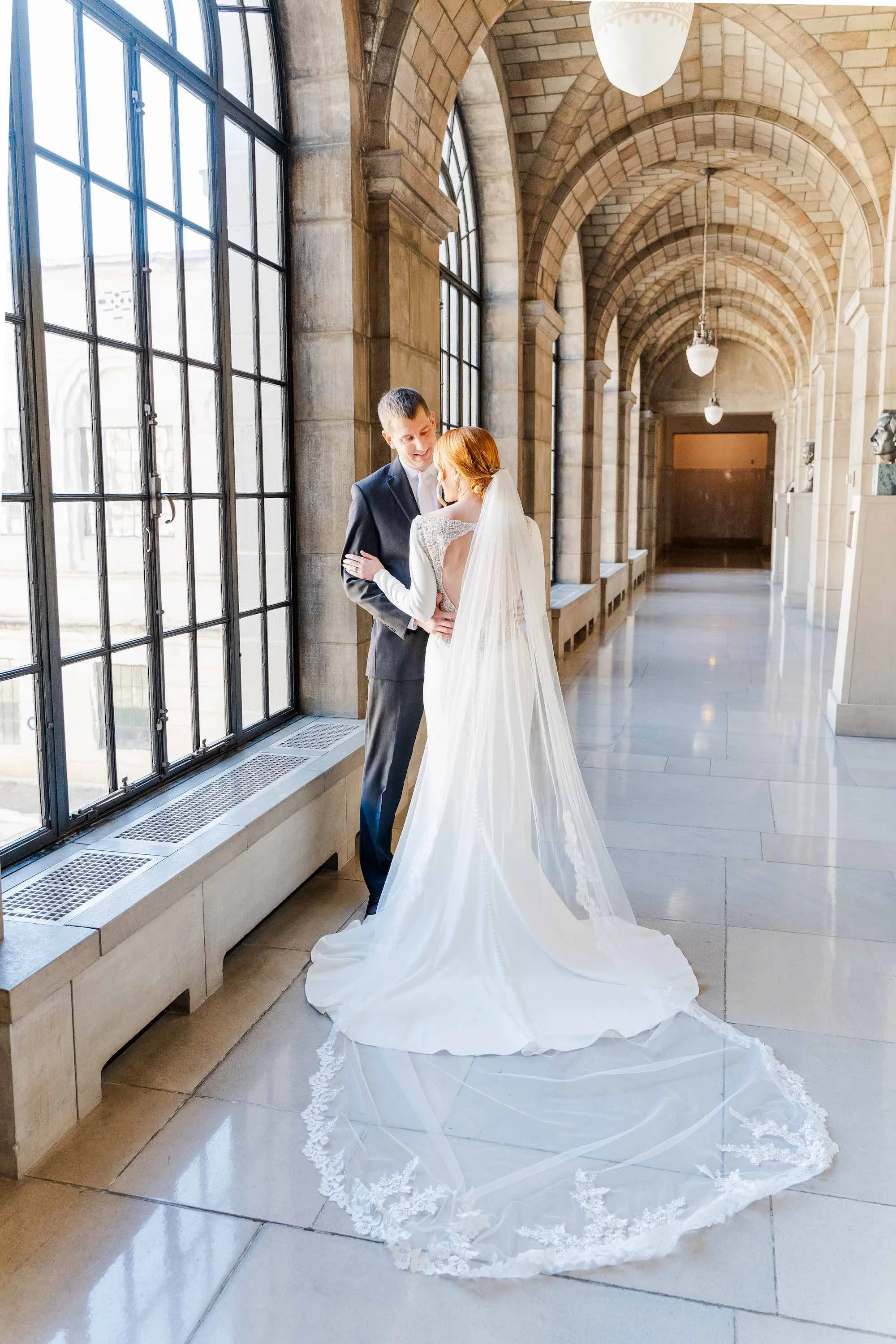 bride and groom posing for a picture on their wedding day