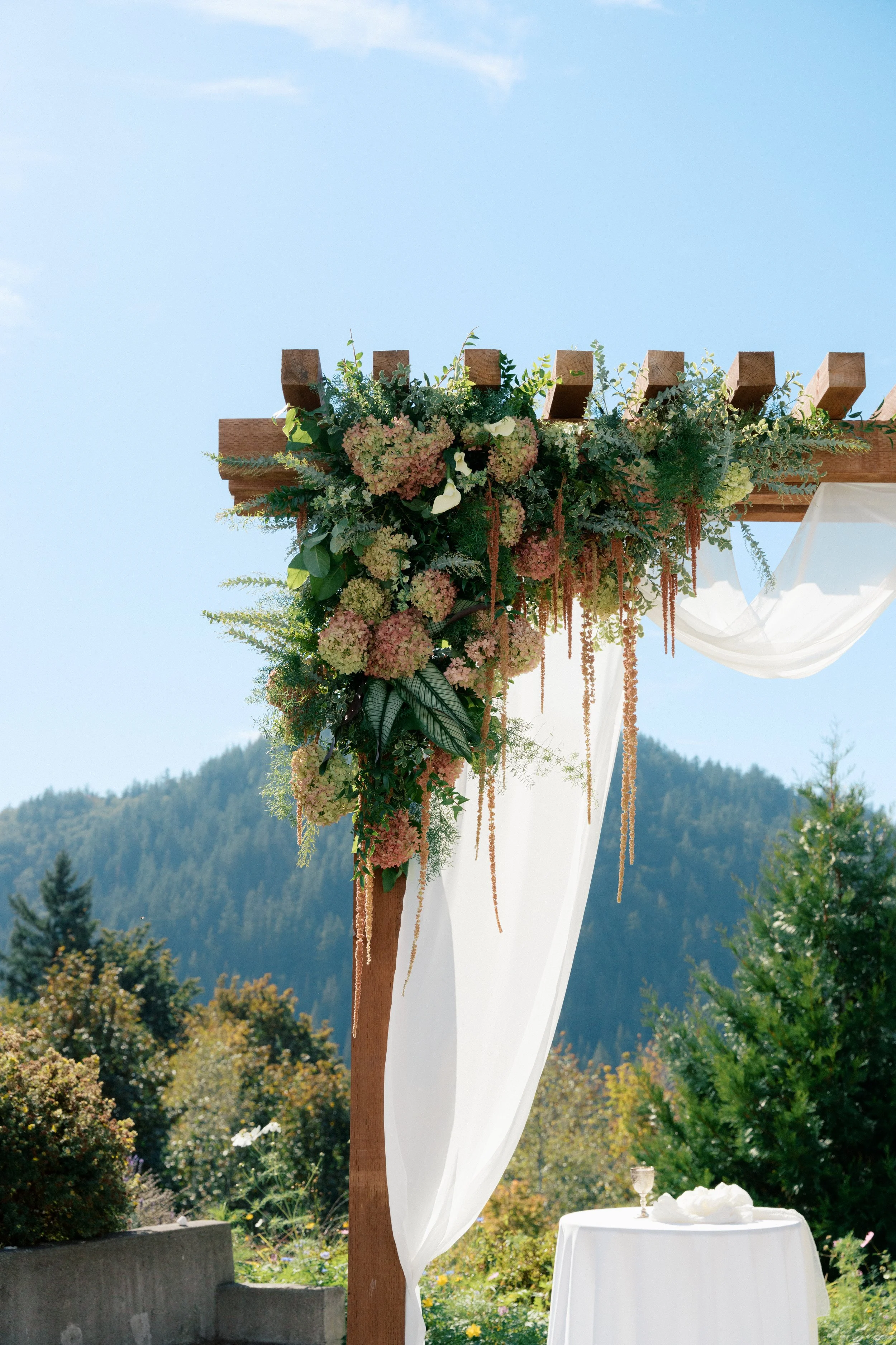 asymmetrical wedding arbor floral installation.