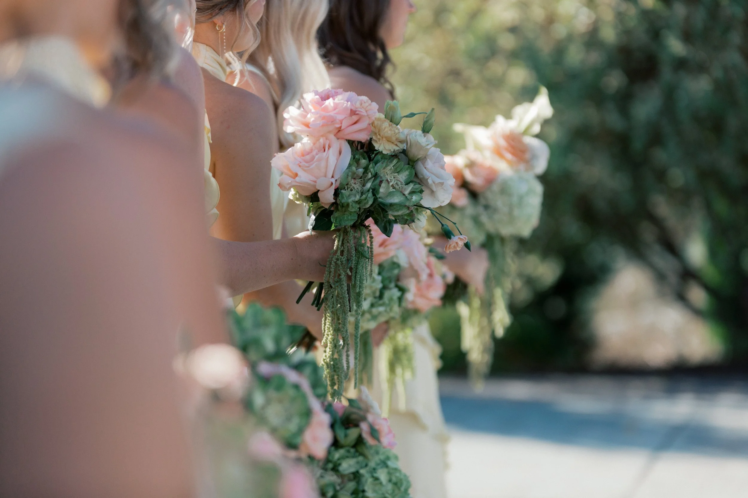 bridesmaid bouquets with peach roses, garden vegetable roses, amaranth and carnations