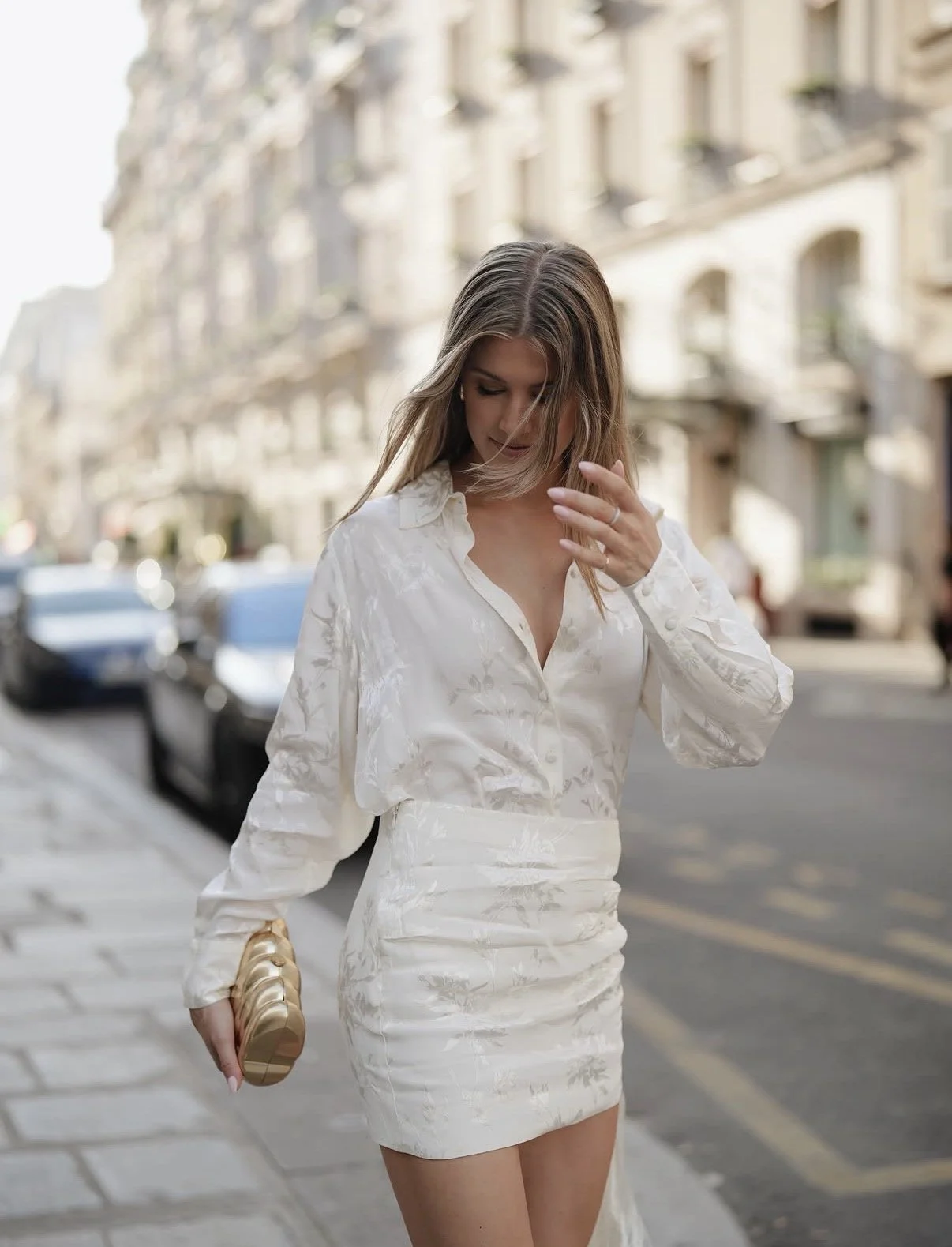 Styled by Virginia client, Genie Bouchard in a white outfit with gold clutch in Paris France for 2026 French Open
