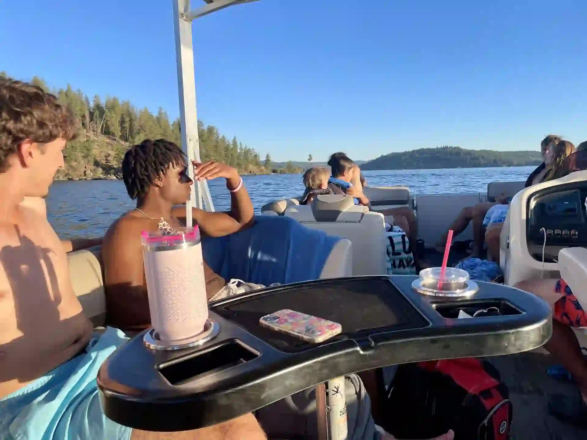 A group of friends and family on a boat