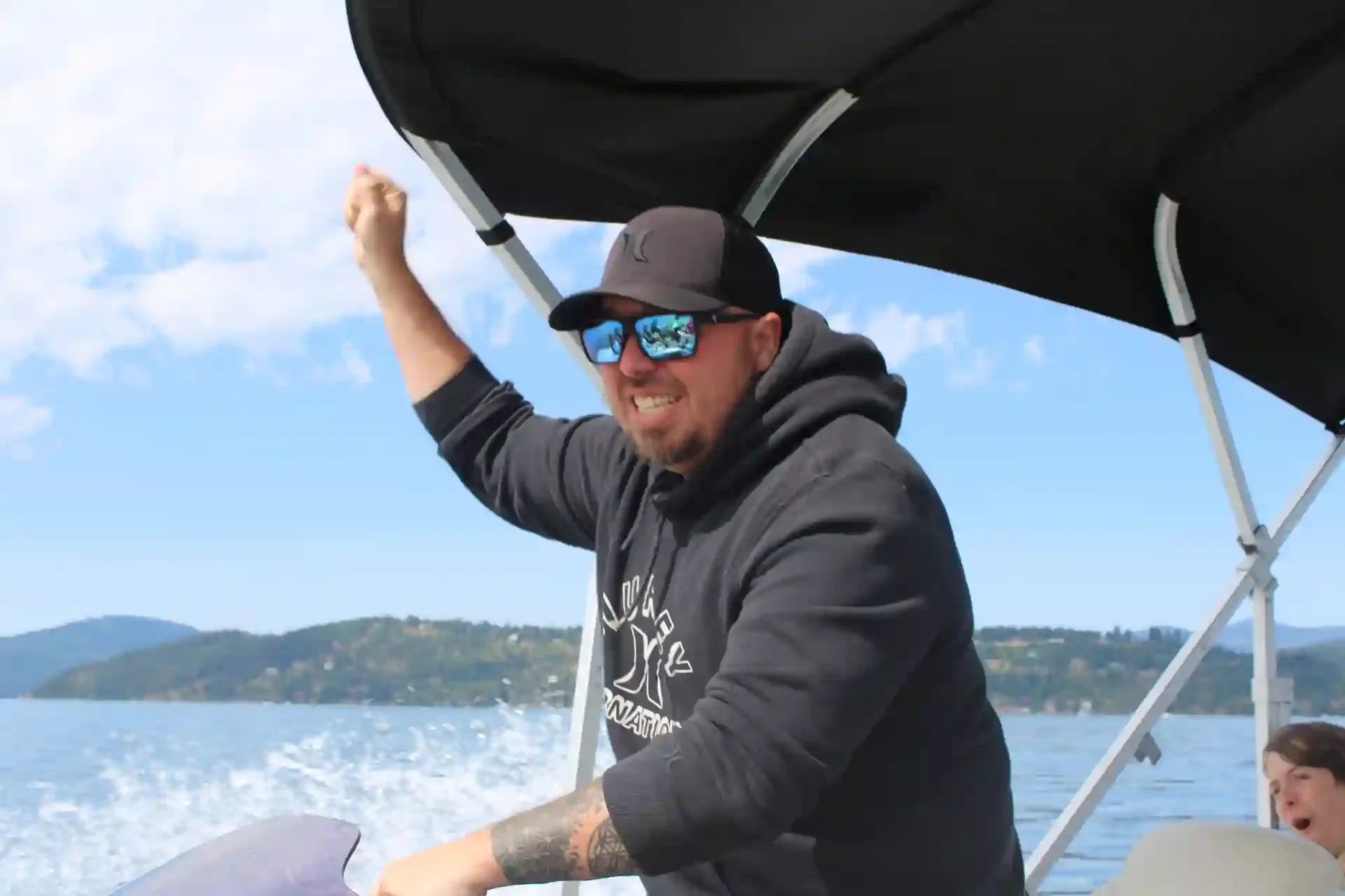A man with an arm up, excited