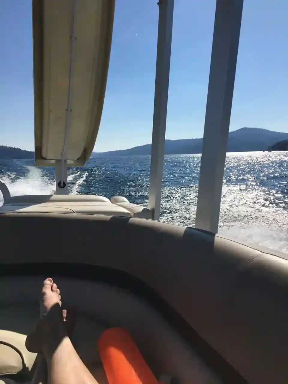 A person lounging in the back of a Funship