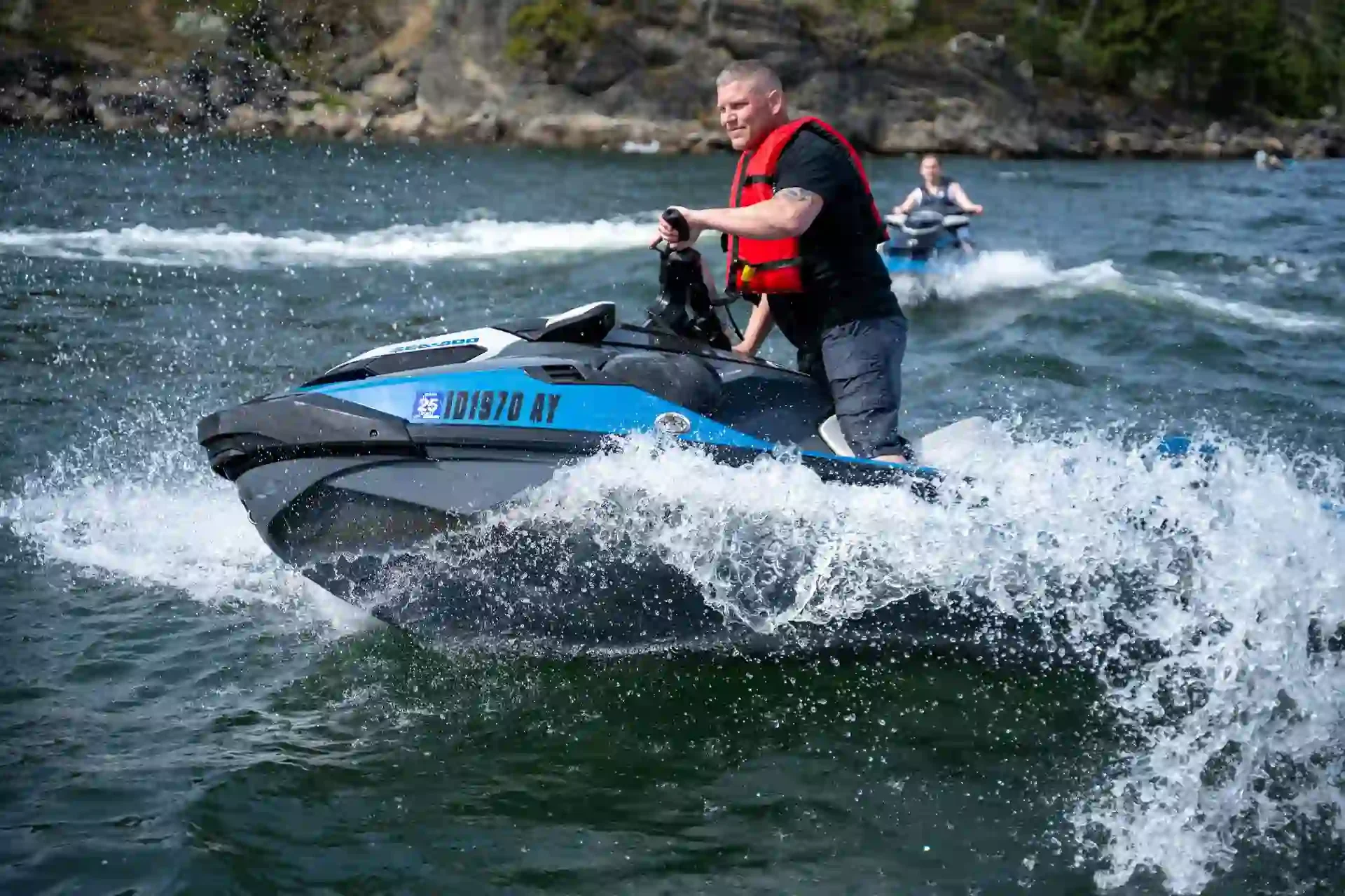 A father and daughter jet skiing