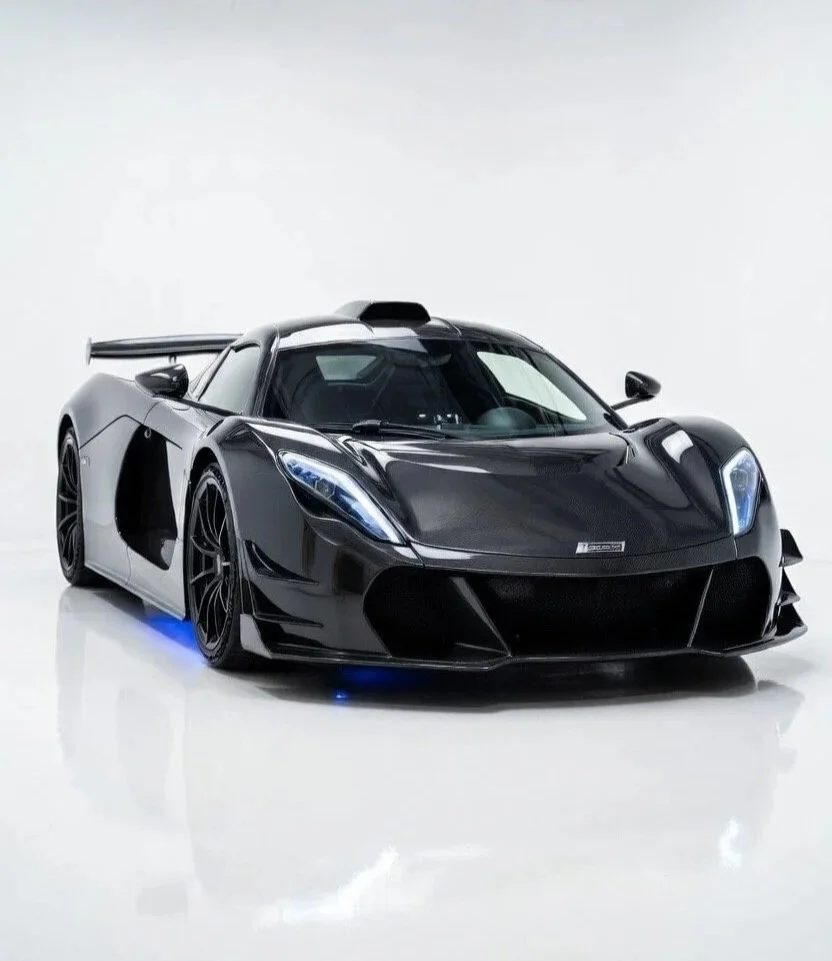 black sporty car in white showroom white walls and ceiling and floor 2 door car