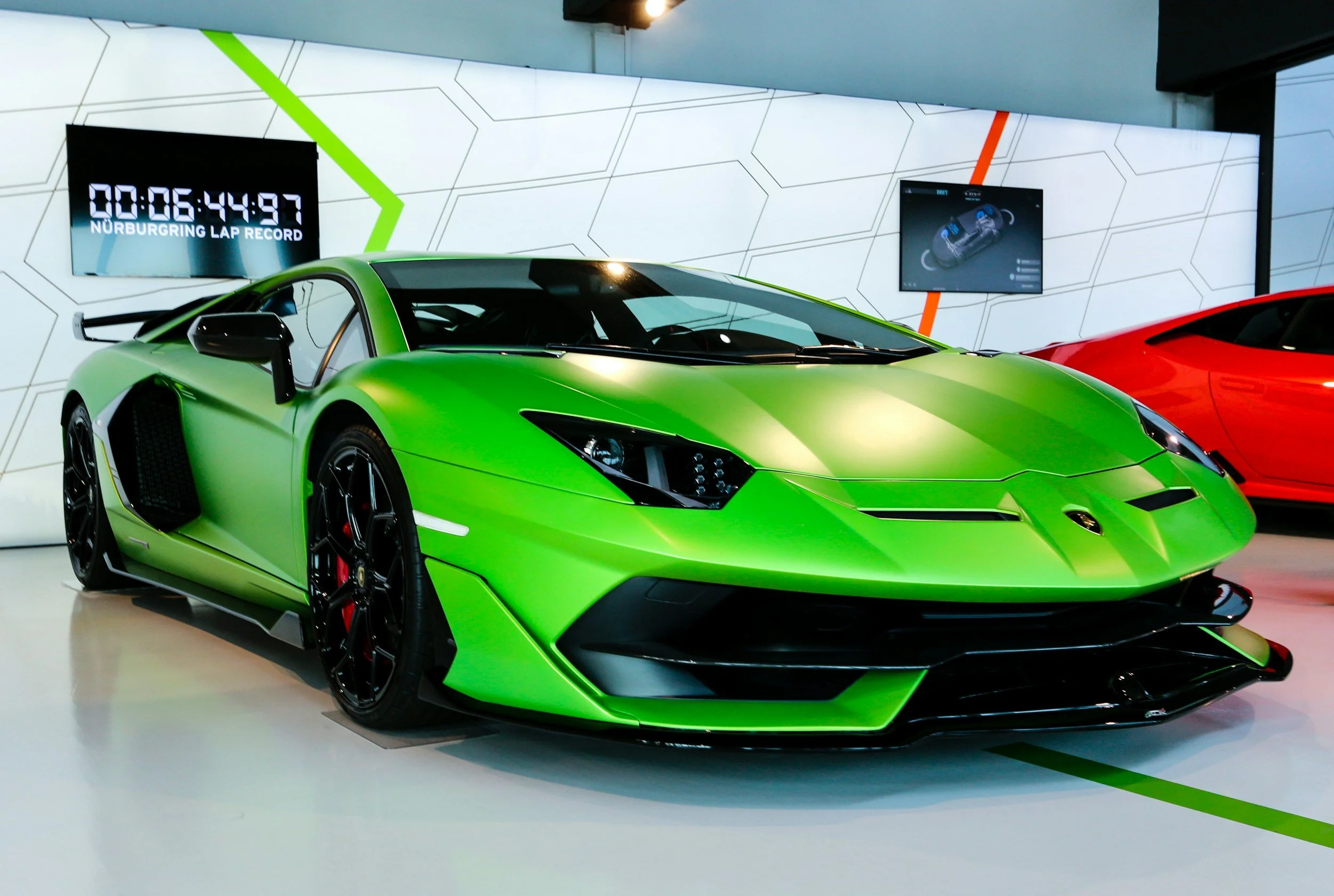 neon green 2 door sport car lots of curves and style black wheels in white room