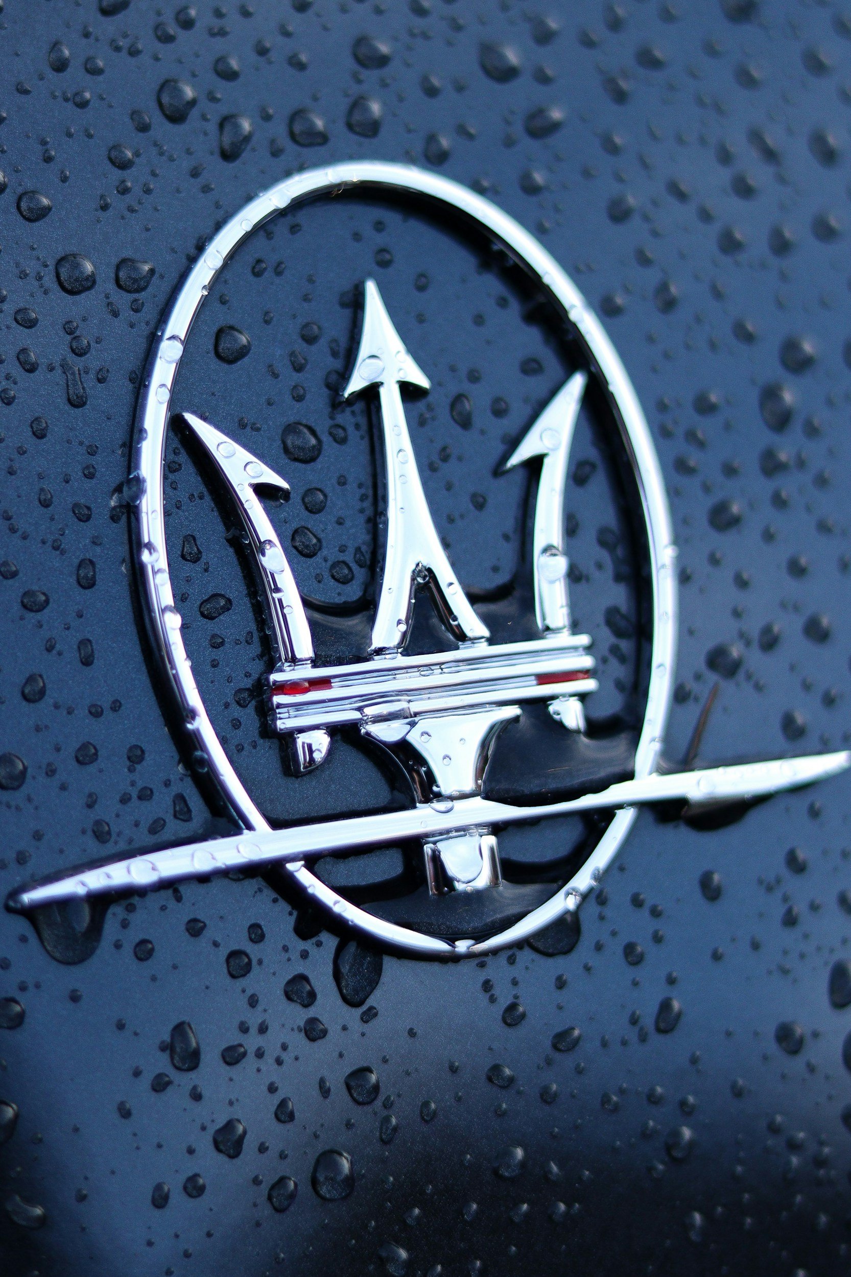 chrome logo for car Maserati with black paint on car