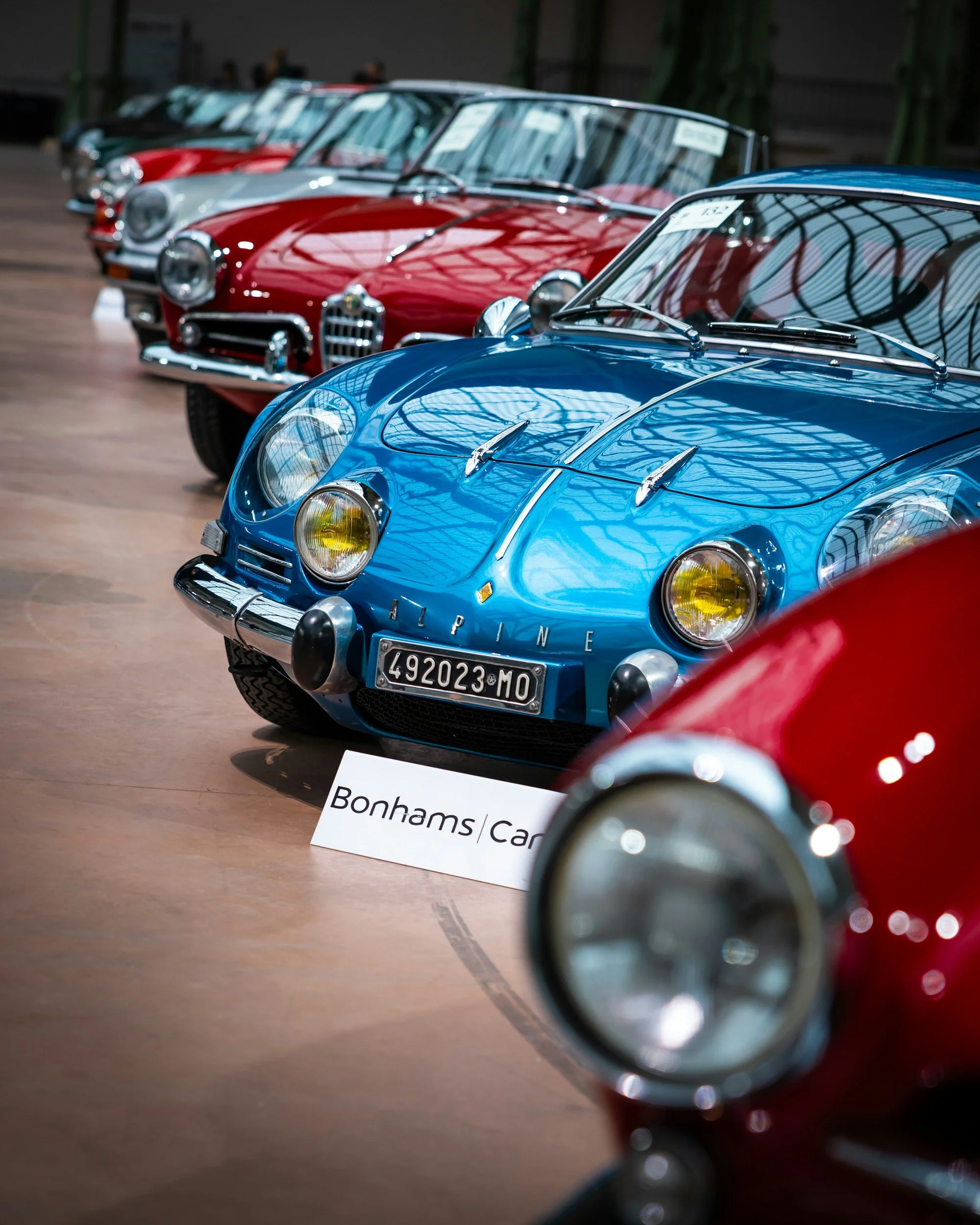 CAR AUCTION RED, BLUE, RED, SILVER, RED, BLACK CARS ALL IN A ROW
