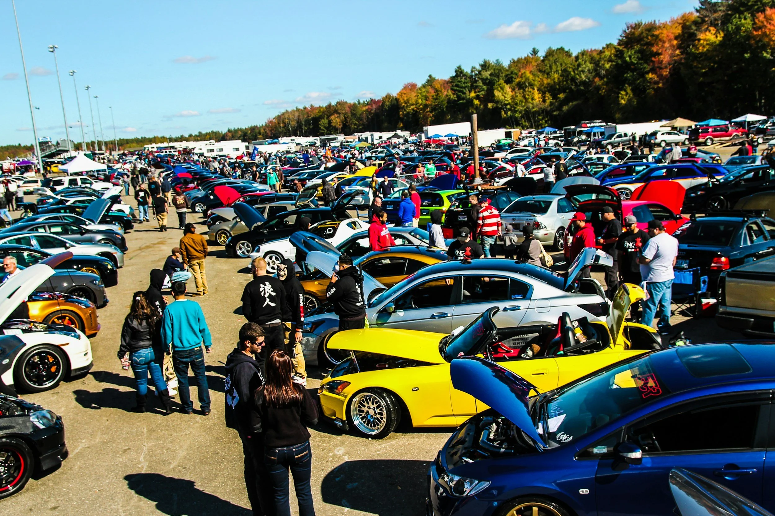 vary large car show with hundreds of cars and people