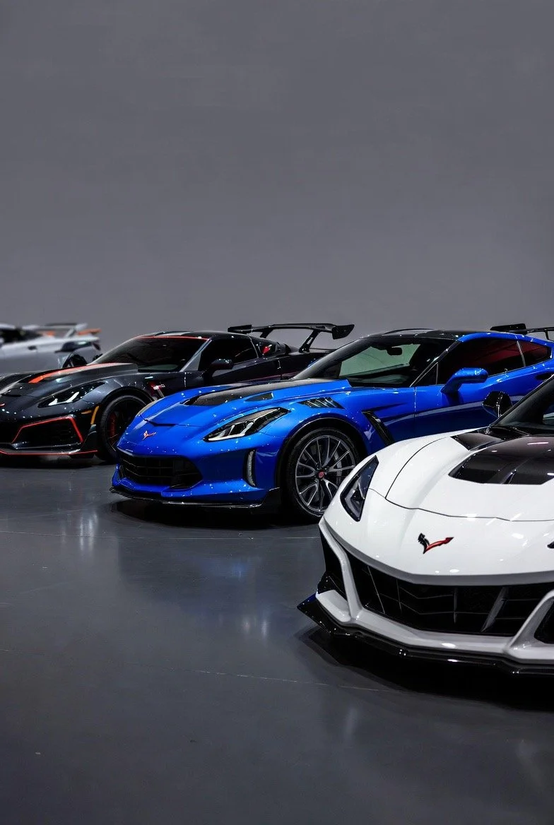 4 corvette cars 2 doors silver blue white black with wings rear spoilers