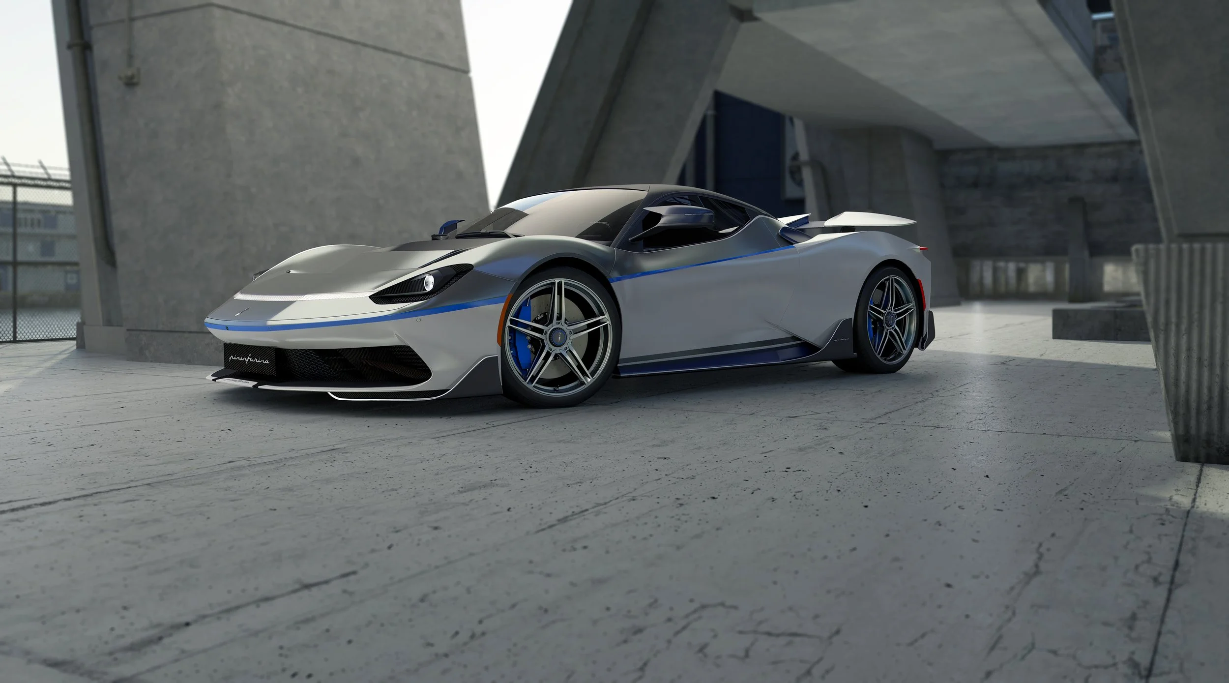 silver 2 door sportscar parked in architectural building outside