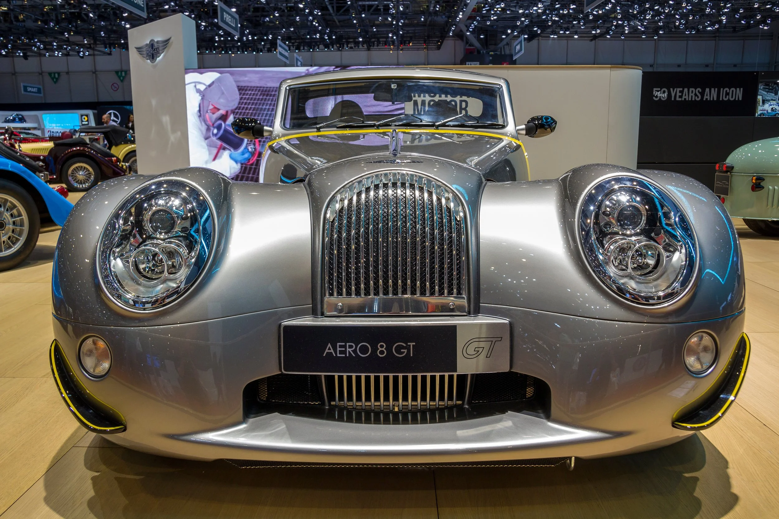 old illuminum colored car in a museum morgan cars