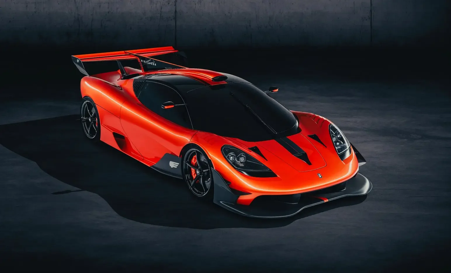 orange supercar futuristic car in black room setting