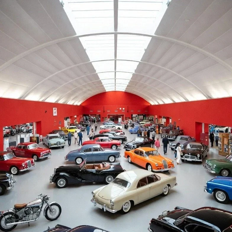 red room white roof with orange, yellow red, blue, white sliver tan cars parked as people gather to look with PNW Car Smart