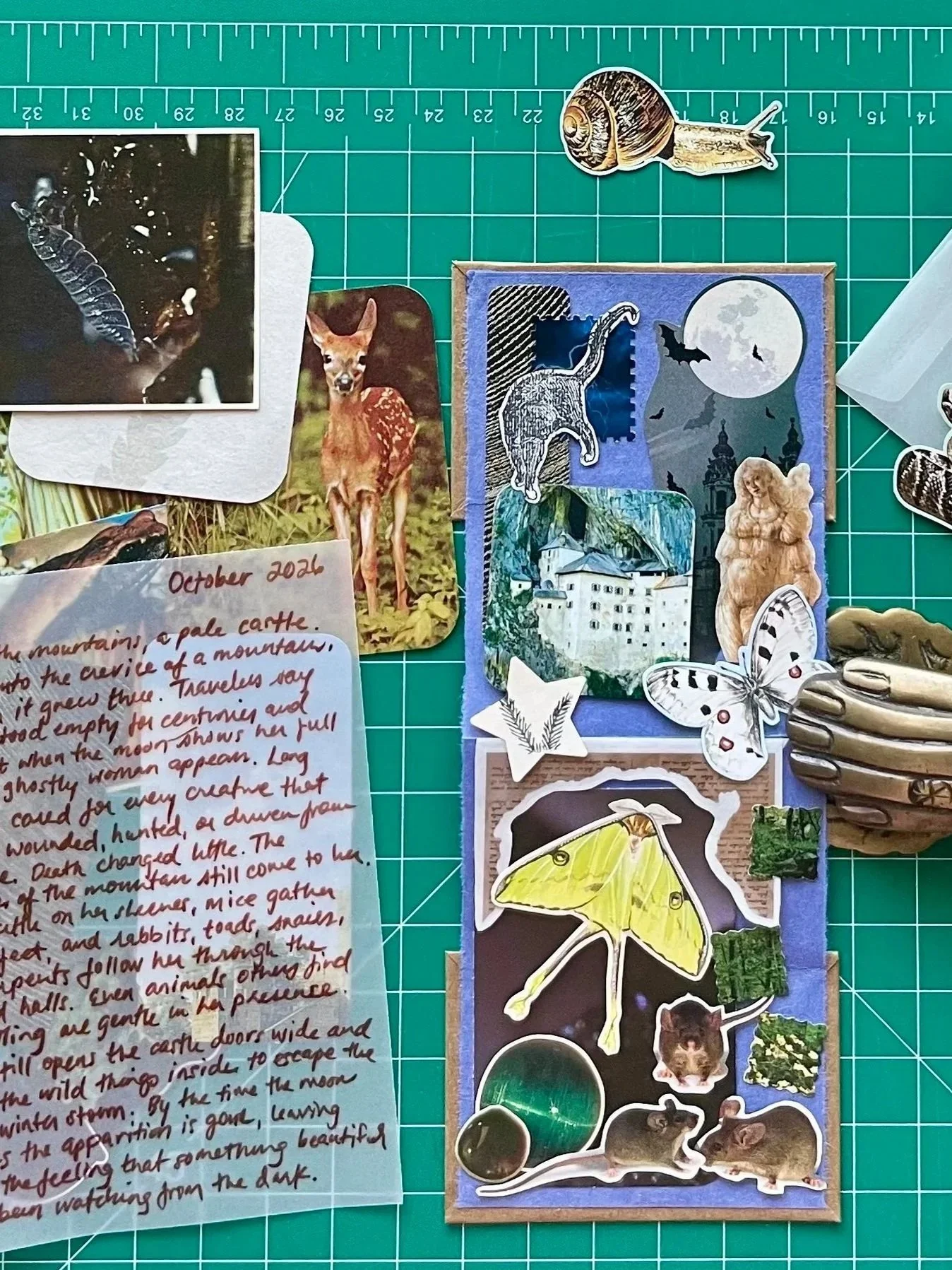 Flatlay example of collage pieces, an original narrative, and handmade journal that comes in the Small Wonders Collage Club monthly subscription.