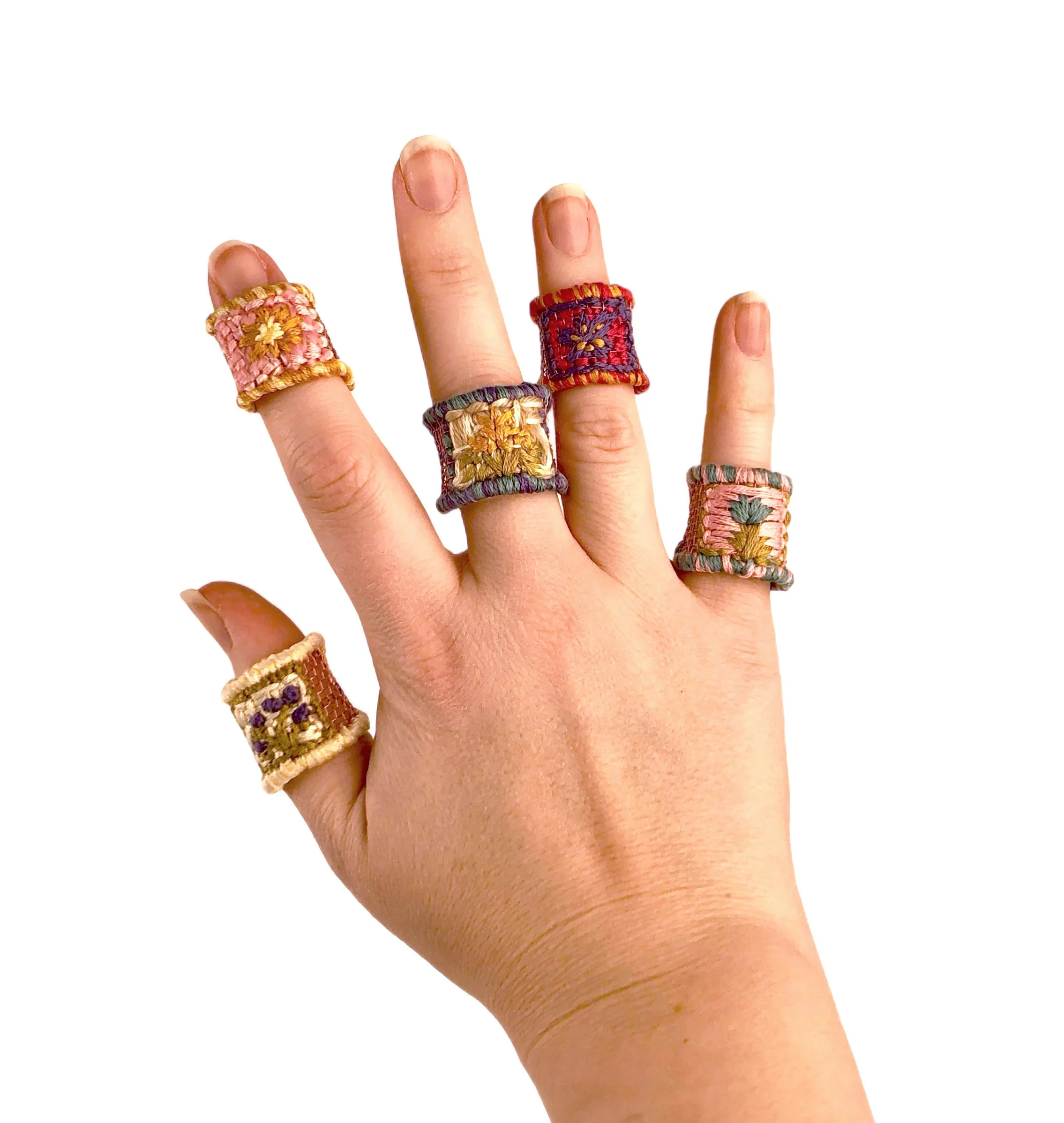 Play (but not) Pretend - Bandaid rings on hand, 2023, Copper mesh, embroidery thread, felt, 2.5” x 0.75”