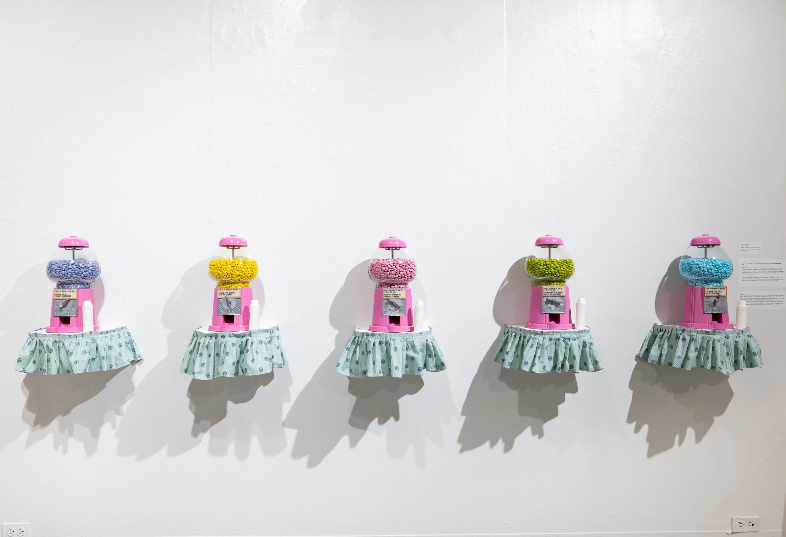 Take Two Be Seen (group of 5)
2025, M&Ms, gumball machines, powder-coated copper, hospital gowns, paper medicine cups
