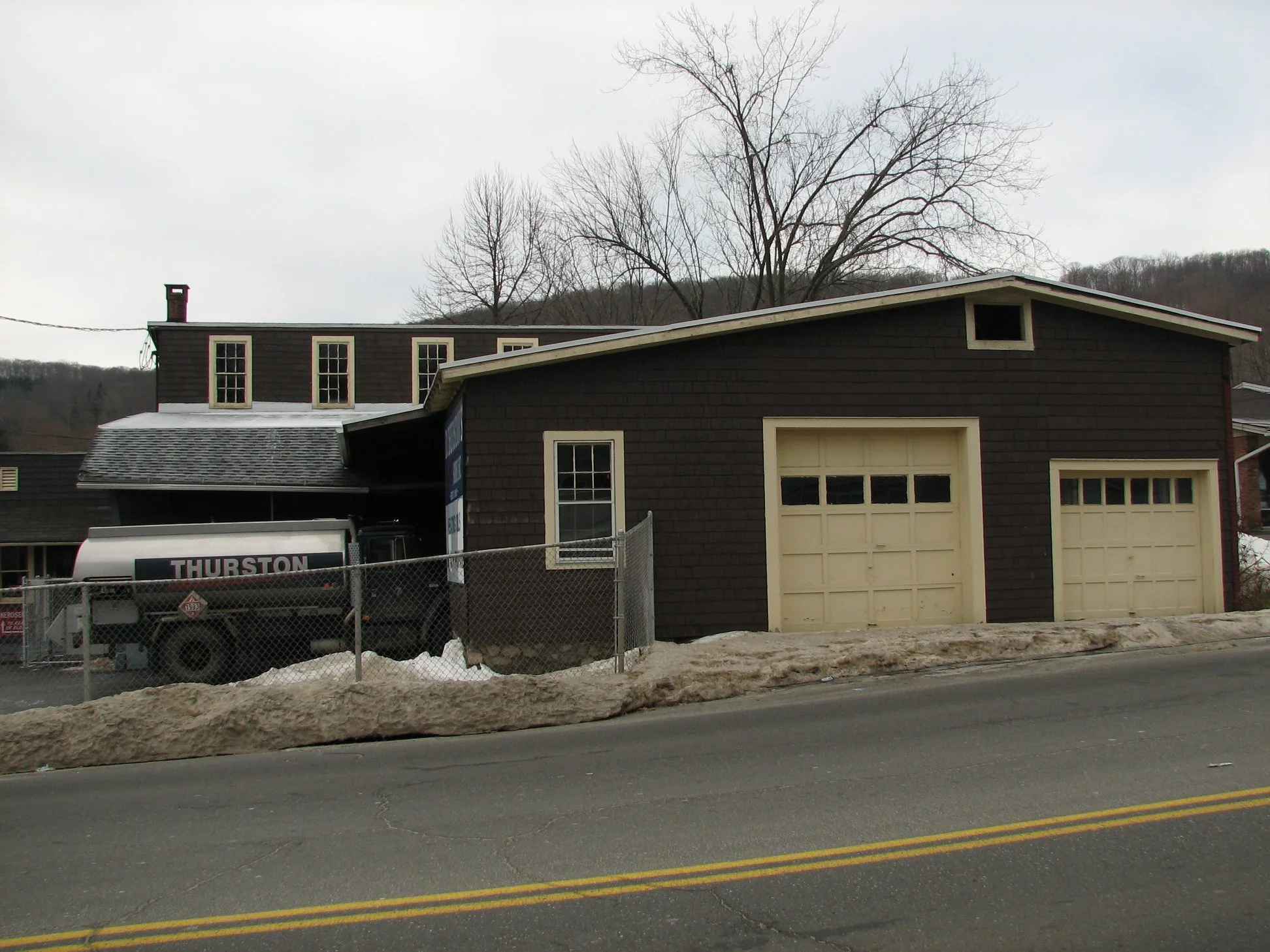 D. Thurston's and Sons on Rubber Avenue - pictures from December 2007.  "The main building had a roof collapse over the original ice house during the heavy snow in January 2011. Due to the damage from the collapse the building was torn down.
I rememb