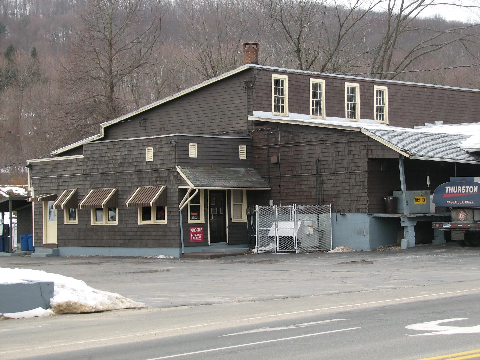 D. Thurston's and Sons on Rubber Avenue - pictures from December 2007.  "The main building had a roof collapse over the original ice house during the heavy snow in January 2011. Due to the damage from the collapse the building was torn down.
I rememb