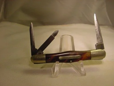 An antique pocketknife manufactured by the Union Knife Company in Naugatuck, CT. The stamp is still visible on the tang.