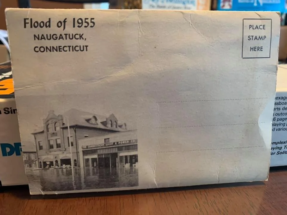 Naugatuck 1955 flood picture mailer booklet. Contains 24 B&W photos of Naugatuck during the flood. 