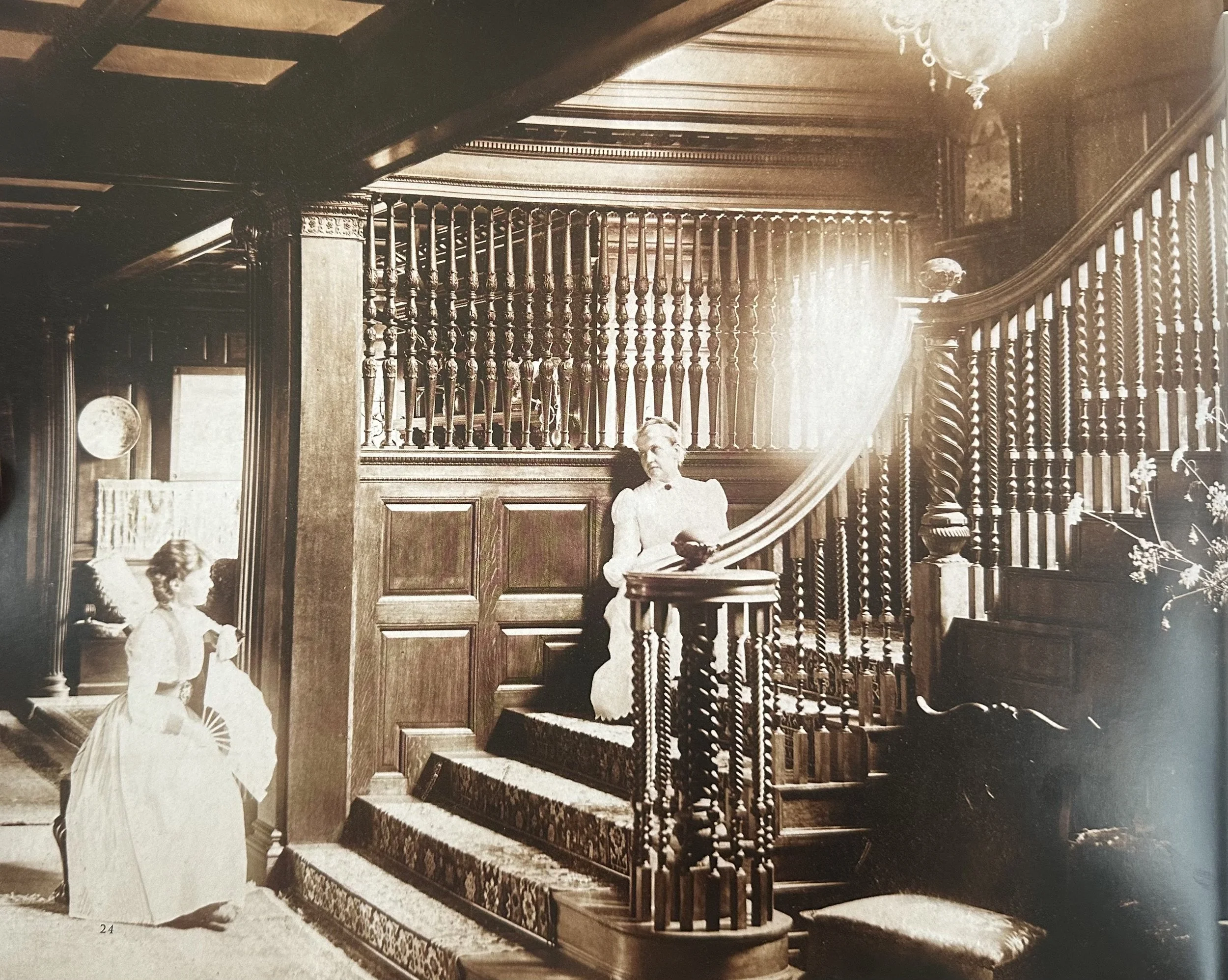 Mrs. Harris Whittemore and Mrs. J.H. Whittemore in the stairwell and cross hall of J.H. Whittemore house - c. 1895