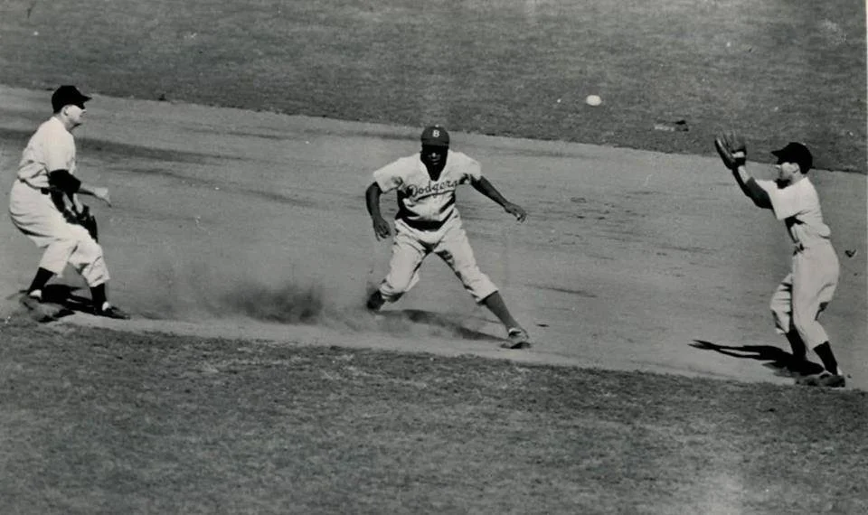 Spec on the far left, and Phil Rizzuto on the right, seem to have the Dodger's famed Jackie Robinson in a bit of a bind!