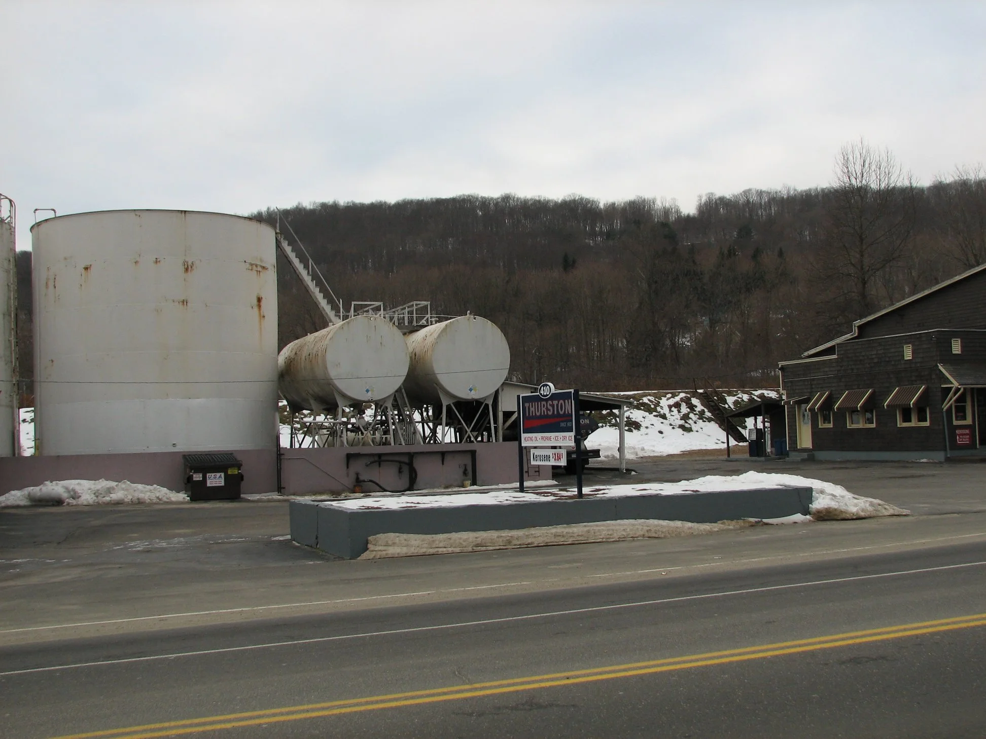 D. Thurston's and Sons on Rubber Avenue - pictures from December 2007.  "The main building had a roof collapse over the original ice house during the heavy snow in January 2011. Due to the damage from the collapse the building was torn down.
I rememb