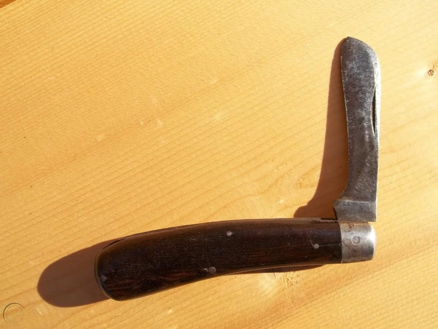 An antique jackknife manufactured by L. Bradley Knife Company in Naugatuck, CT. The stamp is still visible on the tang.