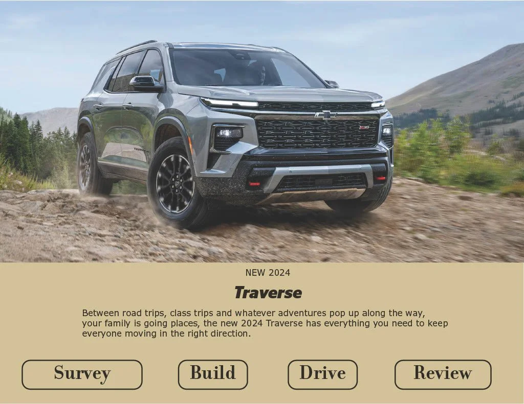 Gray 2024 Chevrolet Traverse driving on a dirt trail through a mountainous landscape with green shrubs and a cloudy sky.