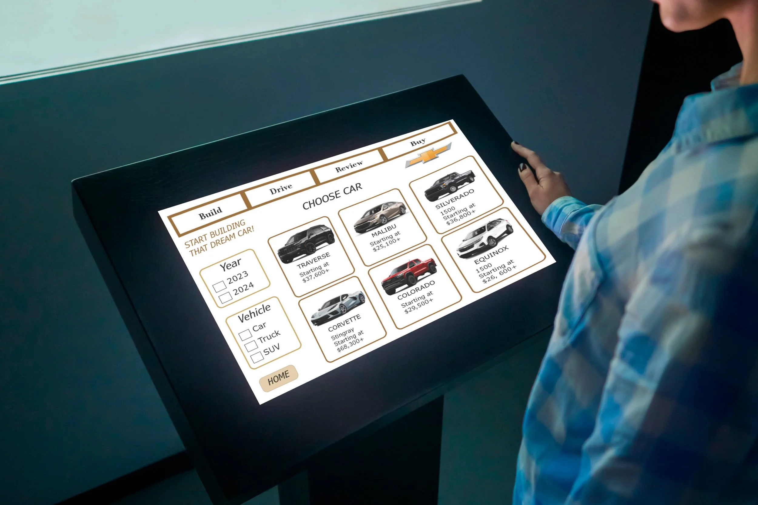 A person in a blue patterned shirt is looking at a digital screen displaying a car shopping website, with car options and prices.