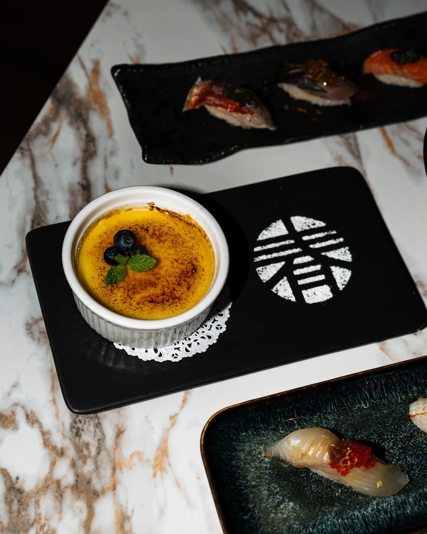 A bright finish to the omakase experience.

yuzu crema catalana, delicately br&ucirc;l&eacute;ed and finished with fresh berries and mint.

#haruomakase #yuzu #dessert #omakase #columbusfoodies