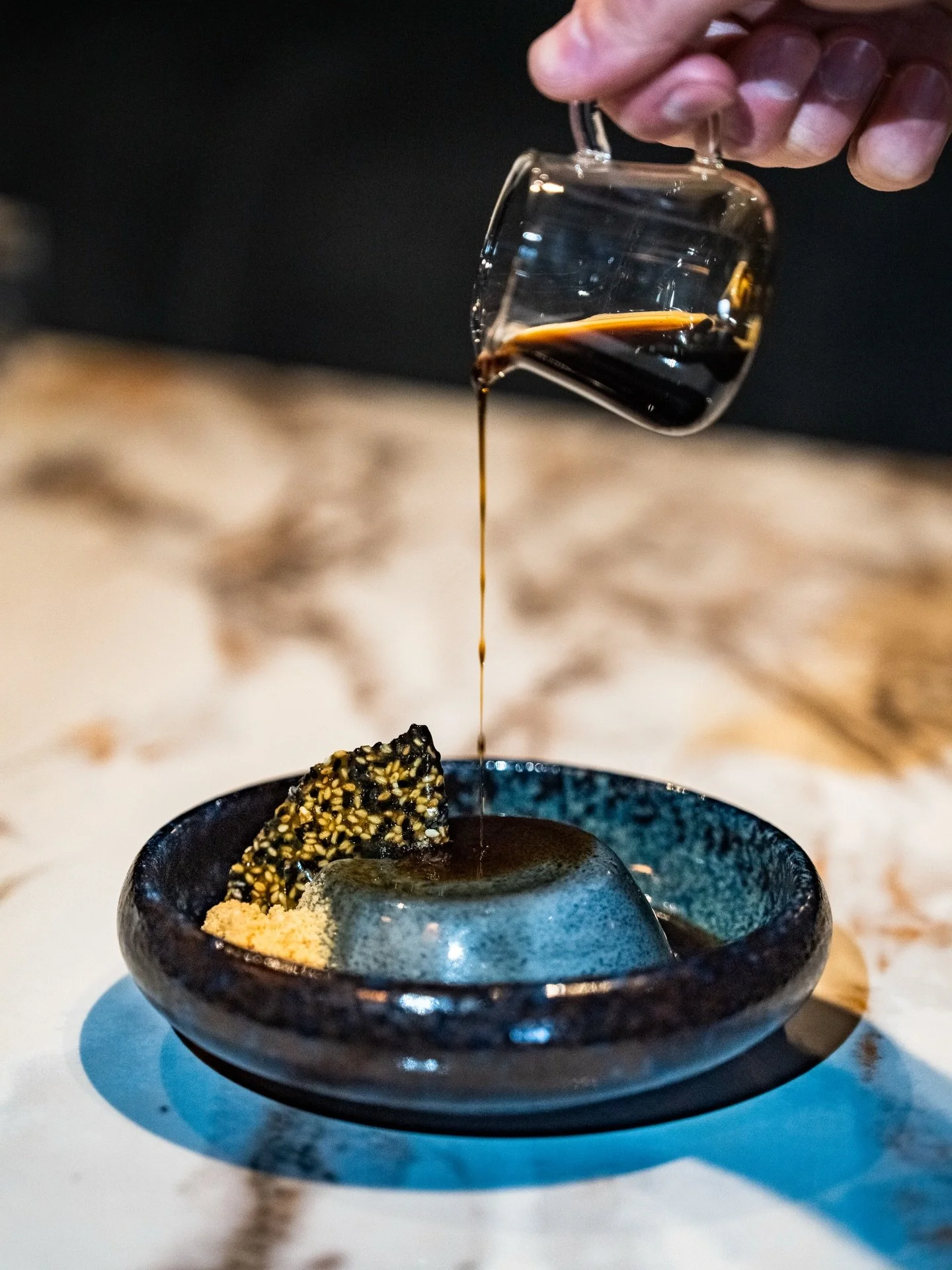 A delicate finish to The Tour

Meet our Kuro Goma Purin! A sesame panna cotta, finished tableside with warm kuromitsu, kinako crumble, and sesame brittle.

A final course that lingers long after the last bite.

#columbusfood #columbusfoodies #ohiofoo