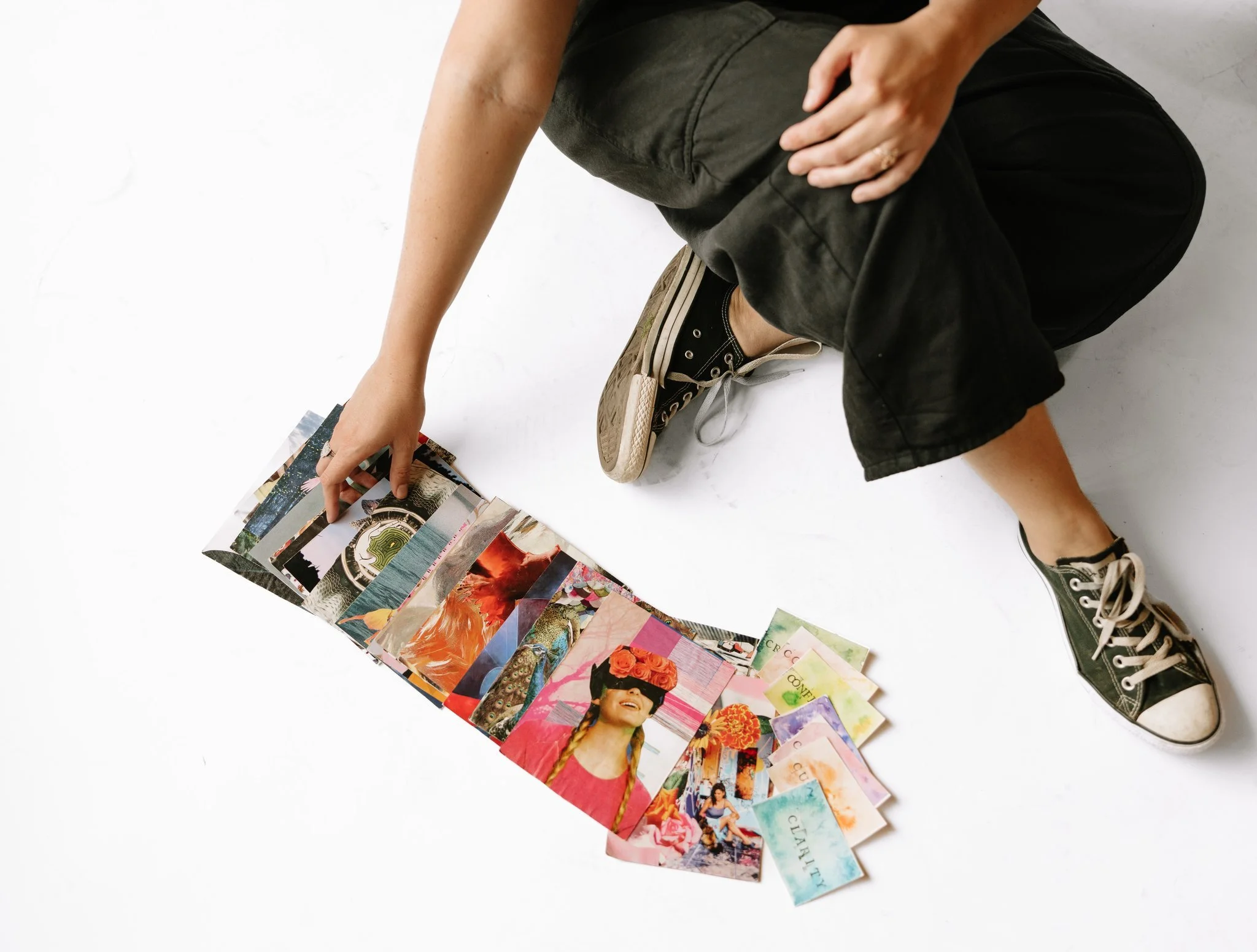 Person rearranging photographs