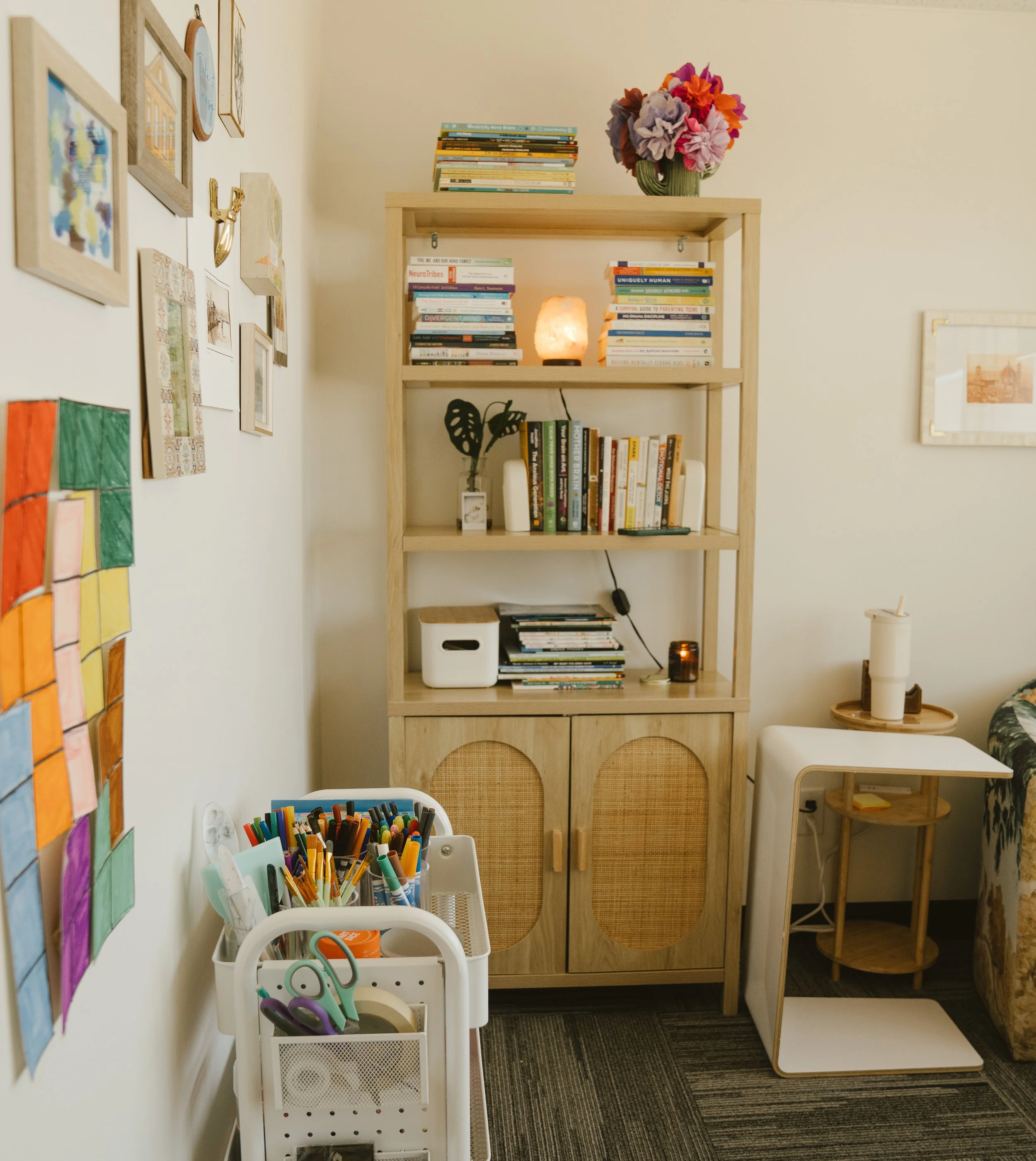 Cozy therapist office with art supplies and book shelves