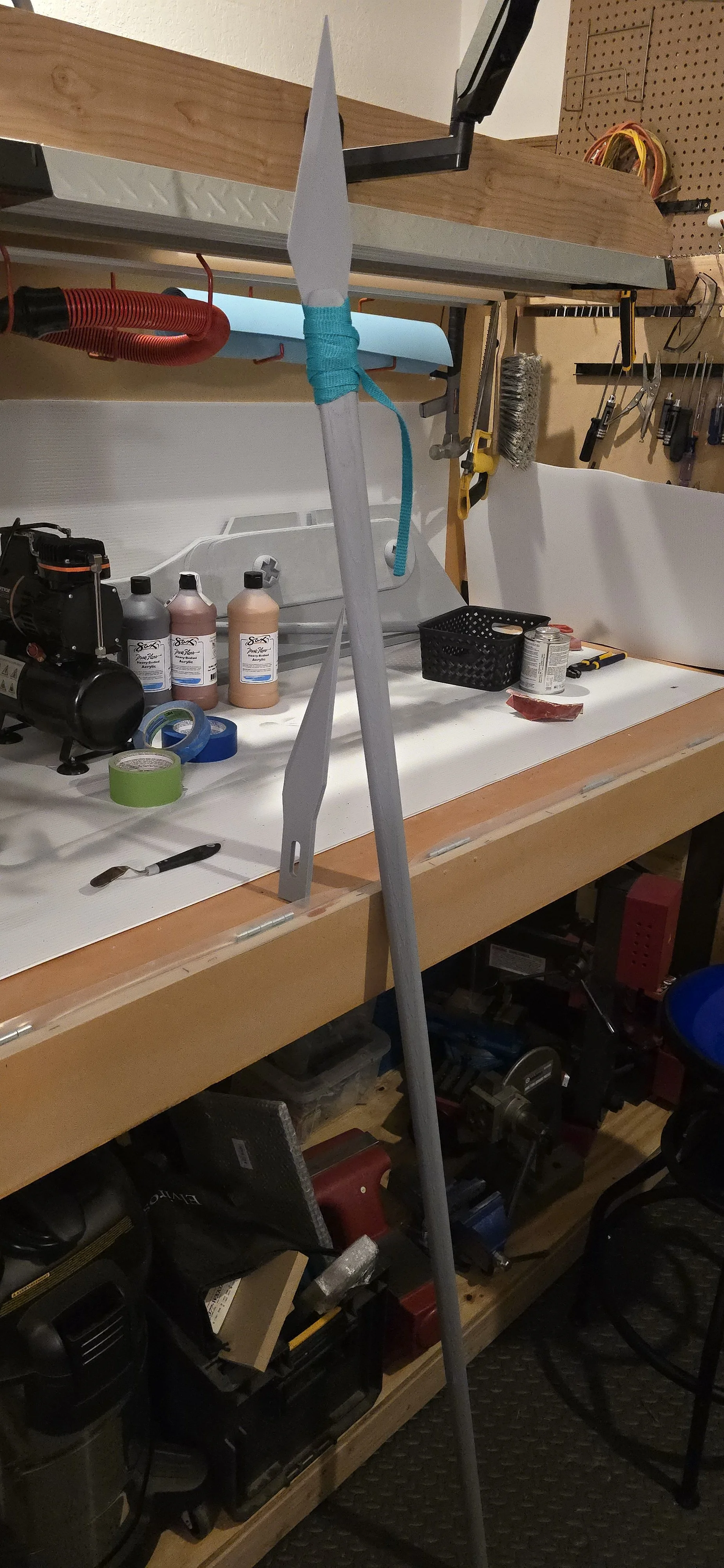 chopstick and x-acto blade spear with dental floss binding