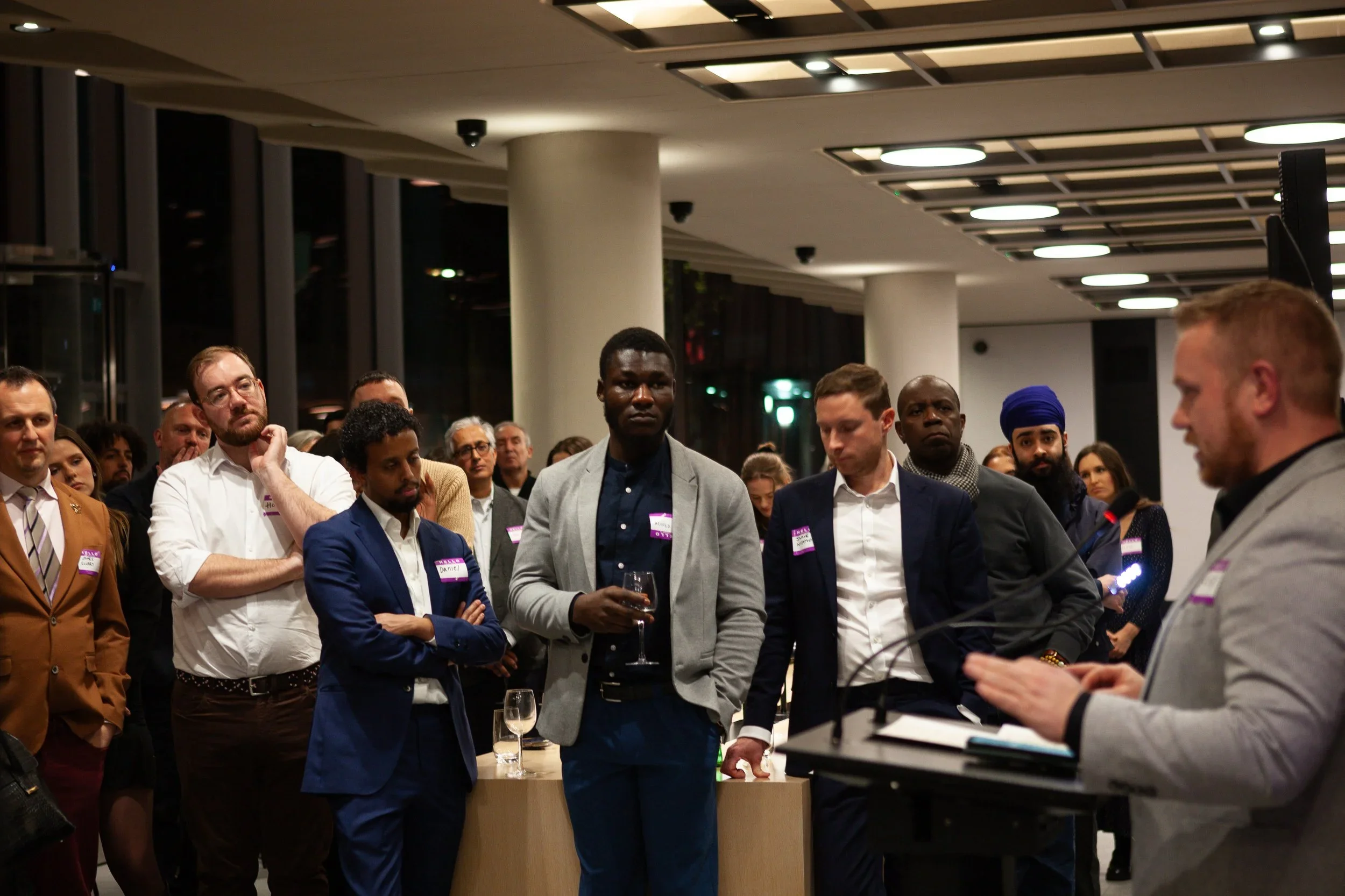 Rob Osborne hosting a reception at ITN for the John Schofield Trust, introducing BBC journalist Clive Myrie to the audience.