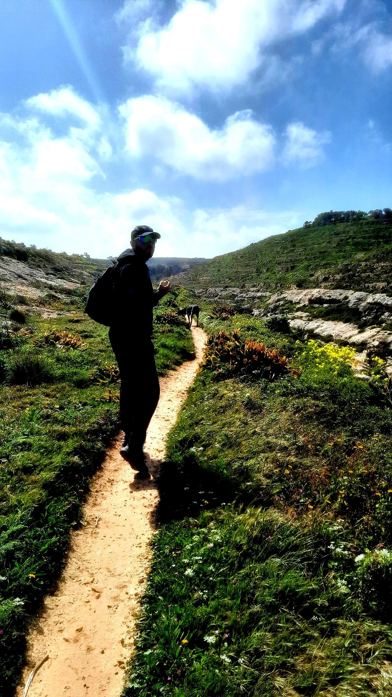 Man looking back while trekking and walking Gozo Malta.jpg