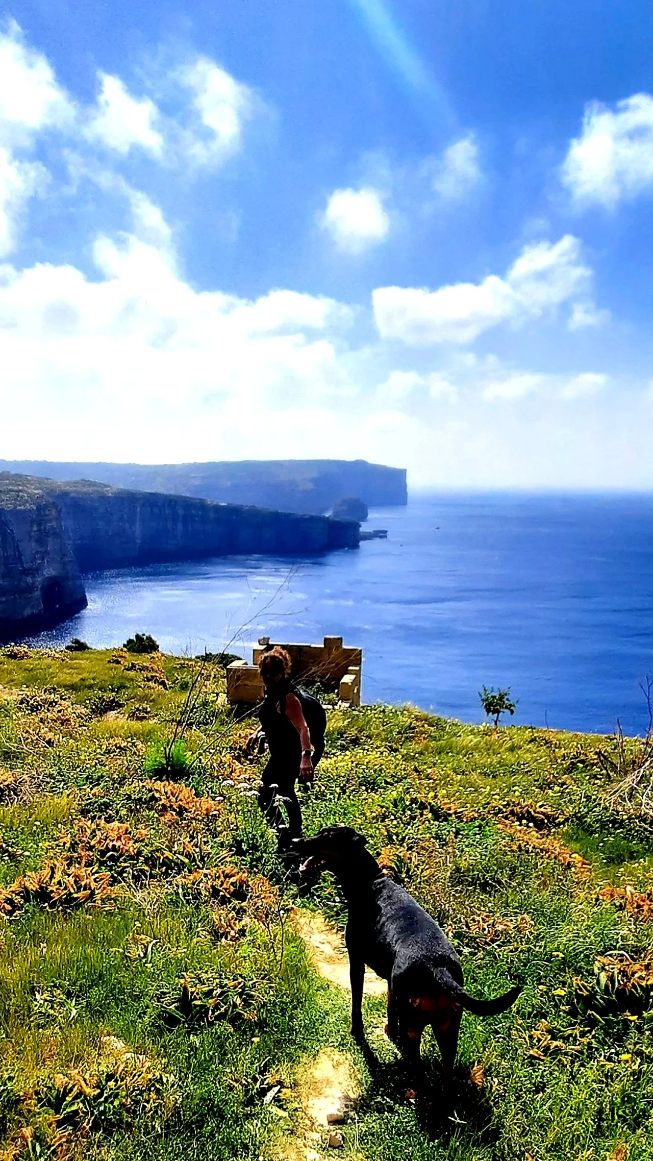 Jacqui and Freya Walking along cliffs Gozo.jpg