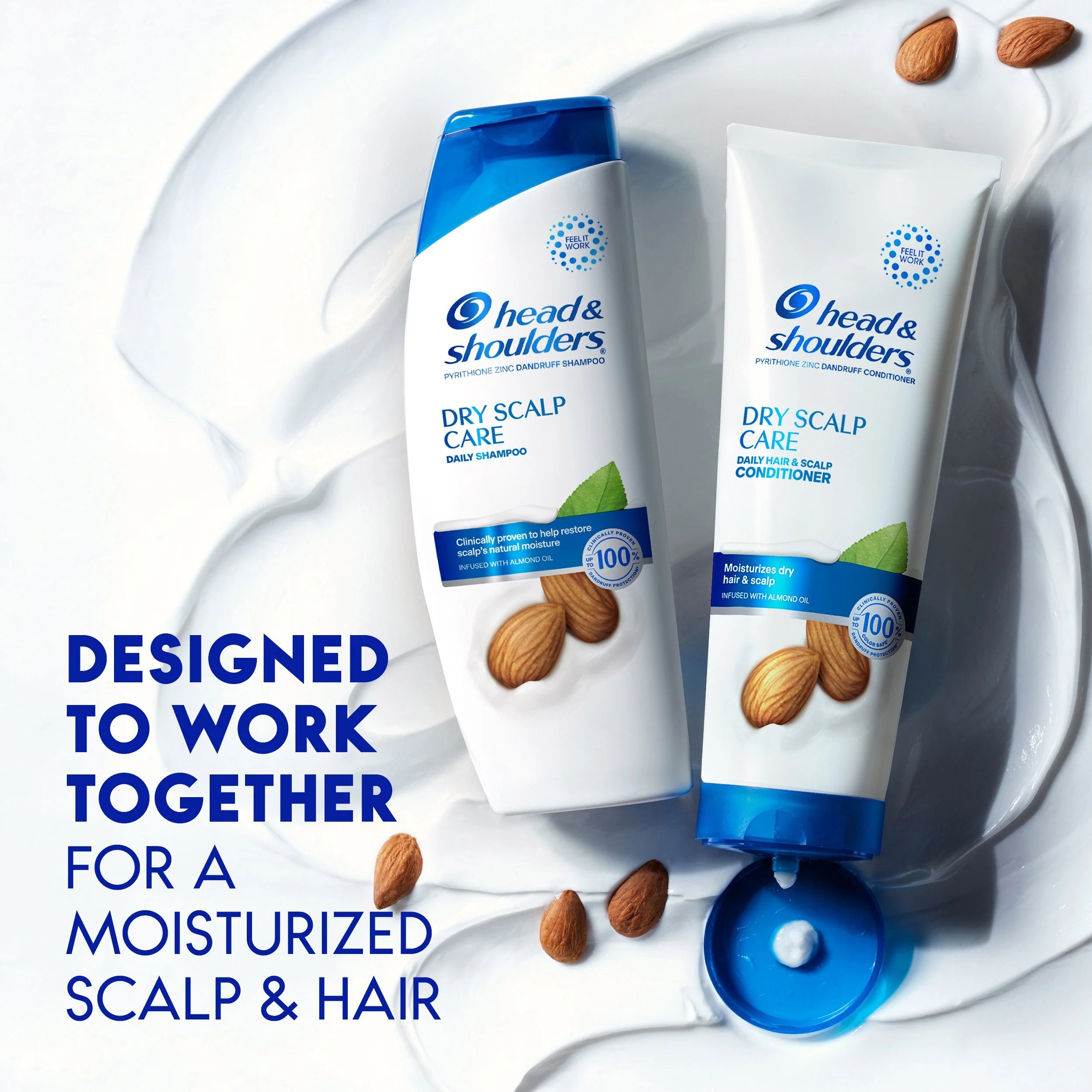 Head & Shoulders dry scalp care shampoo and conditioner bottles on a white surface with dollops of white cream and scattered almonds, with text overlay stating "Designed to work together for a moisturized scalp & hair."