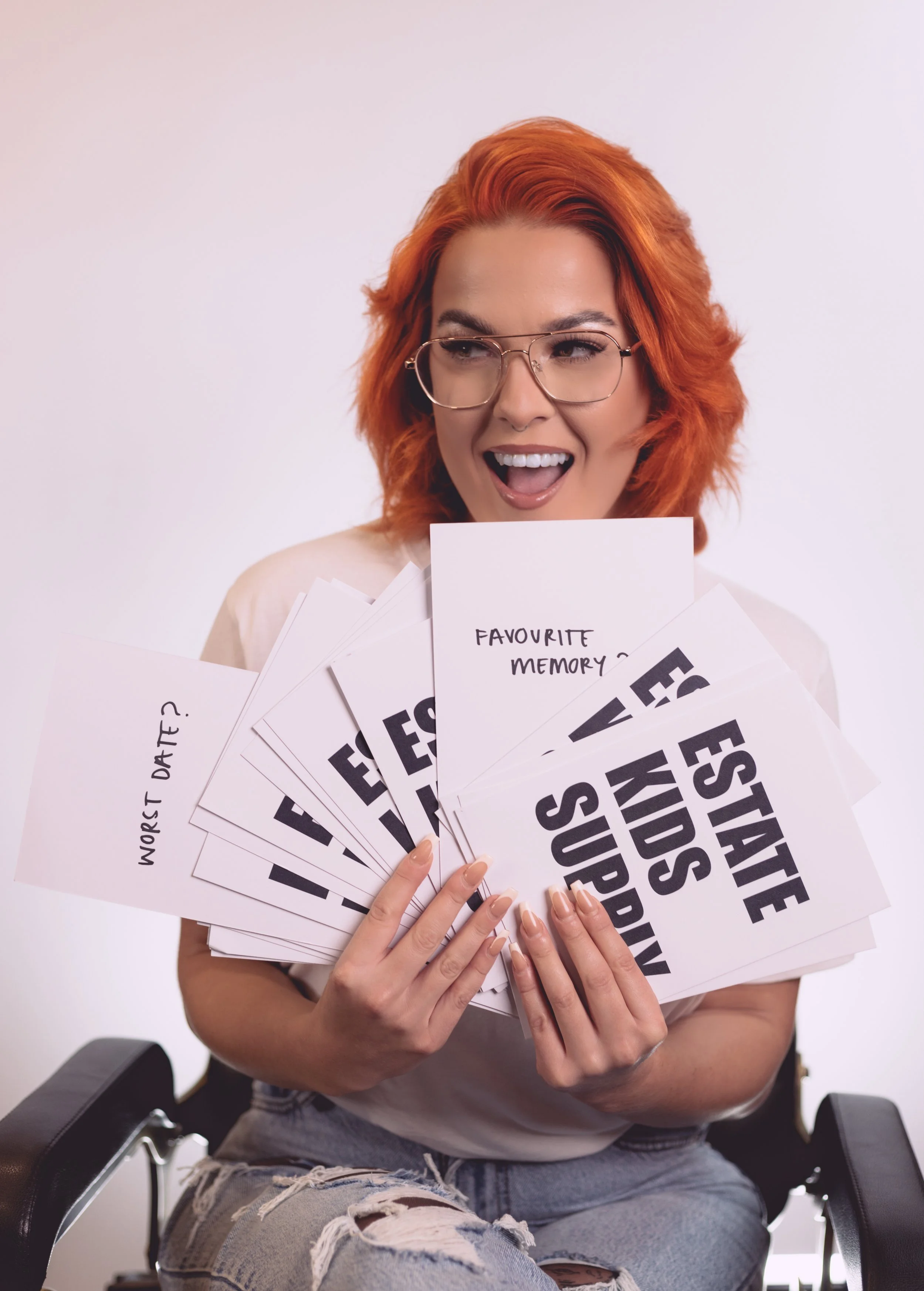 A model holding cards up to the camera