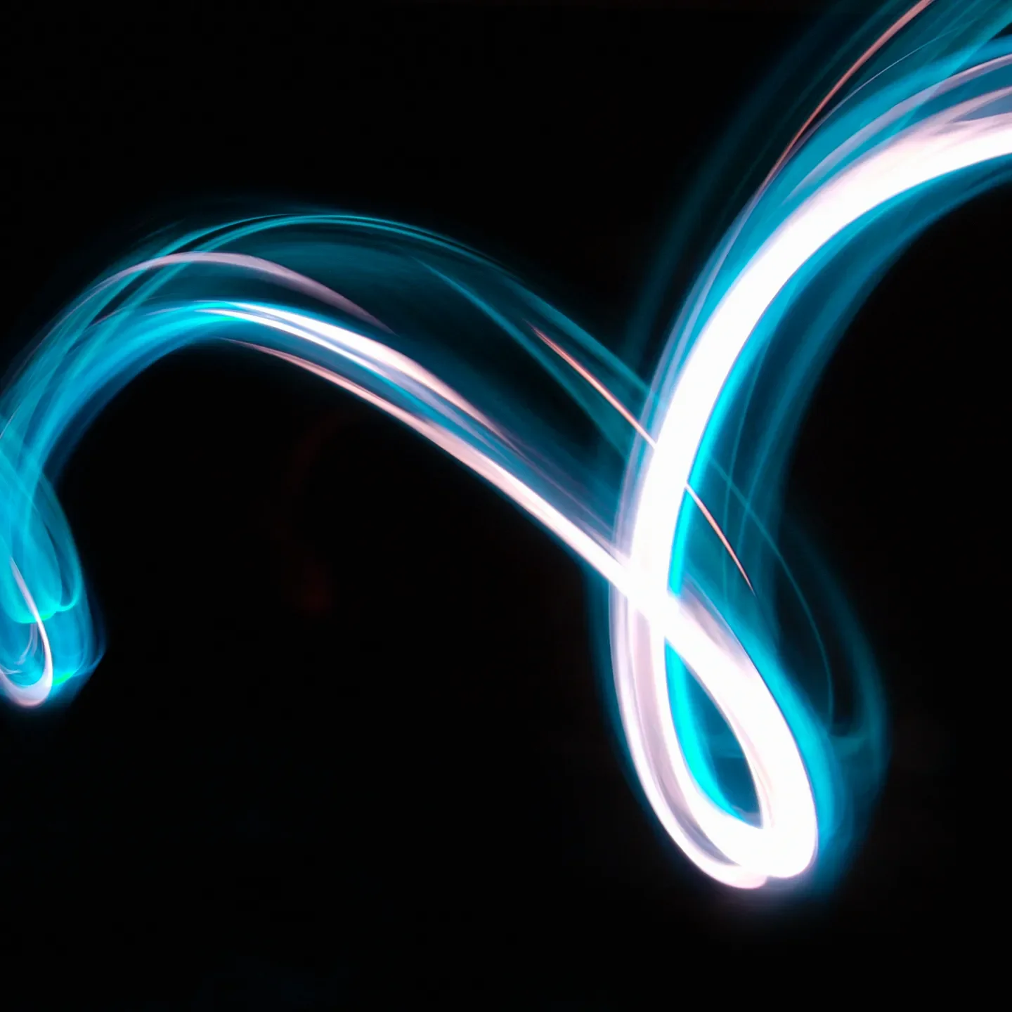 Abstract neon light trails symbolizing Metheus Consultancy’s digital automation consulting services, helping businesses streamline processes with AI and advanced technologies.