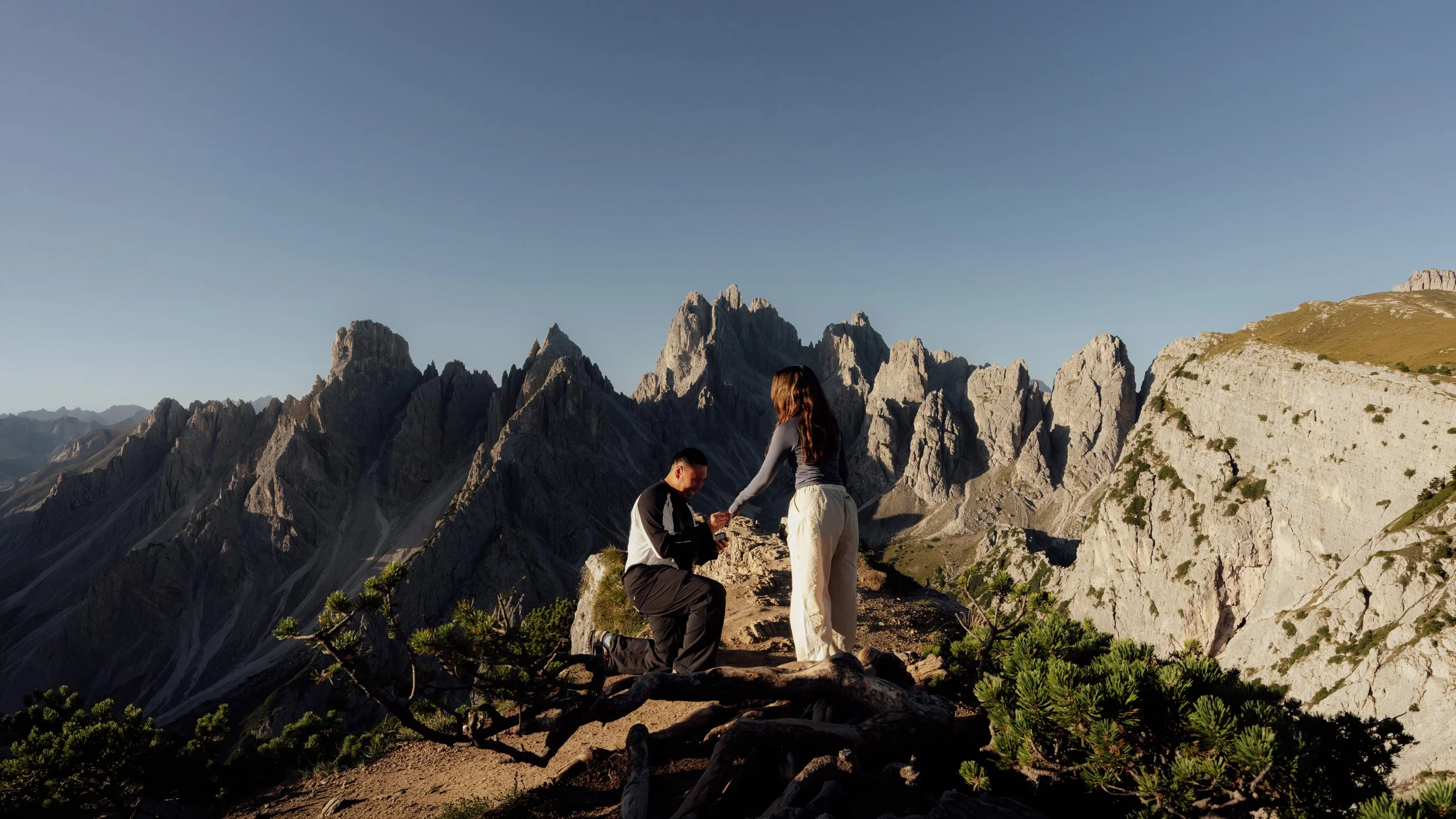 First sunlight illuminating the jagged peaks of Cadini di Misurina at sunrise.