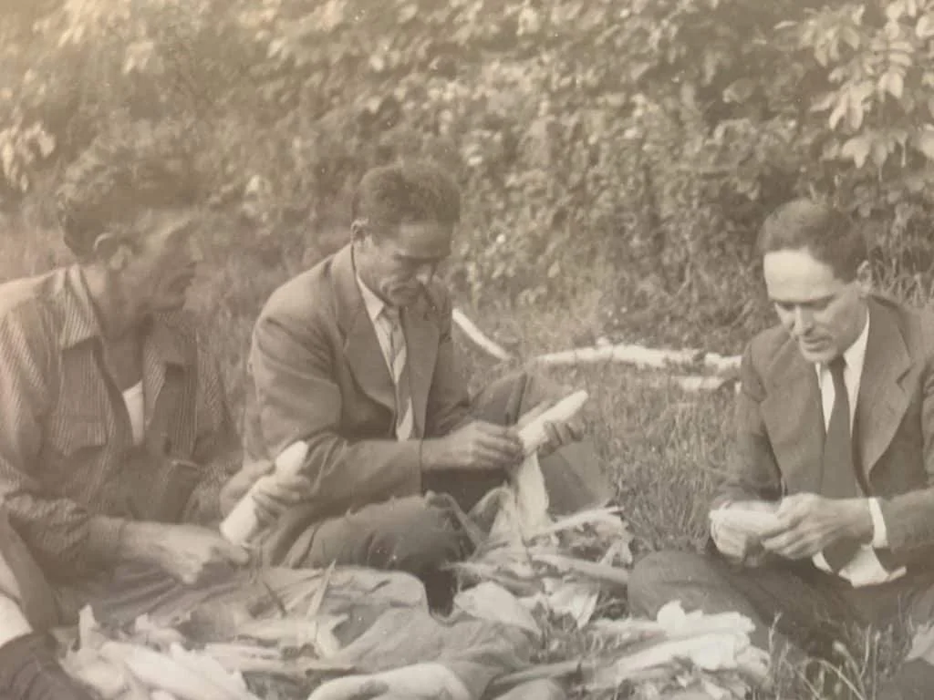 Merv Whitbeck, Tom and Phil Garrett, group shucking corn