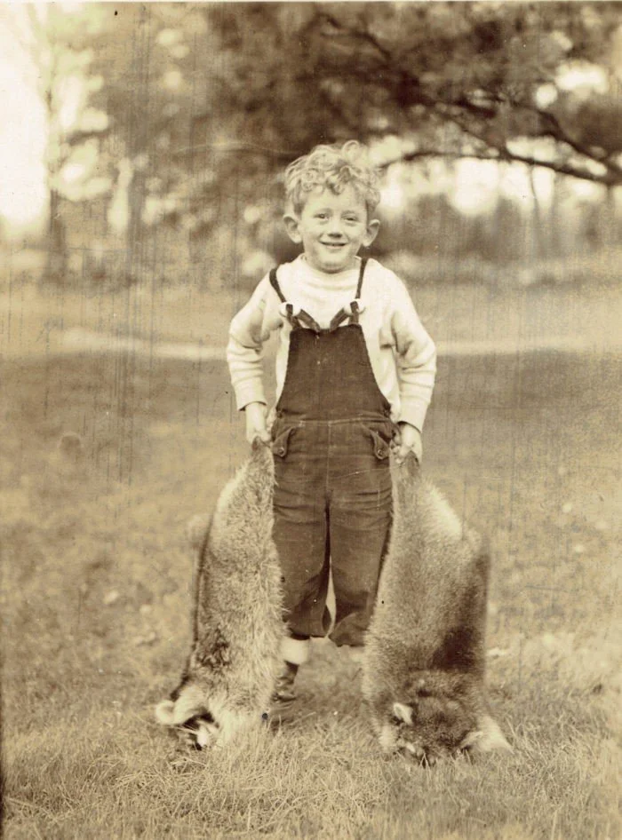 Jimmy Whitbeck with Racoons, 1930s