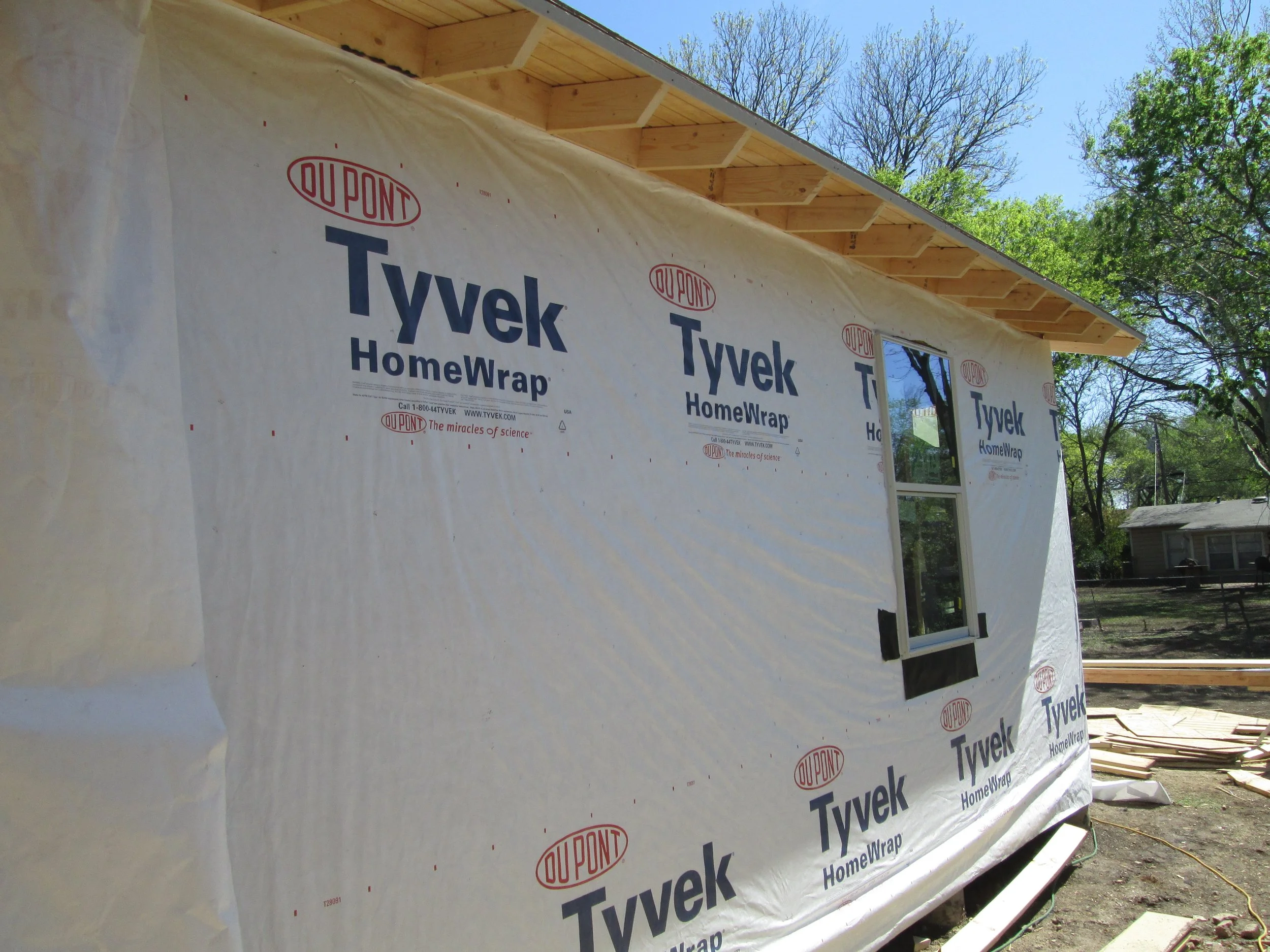 IMG_1507 (house wrap on the addition, soffits and tail ends all done).JPG