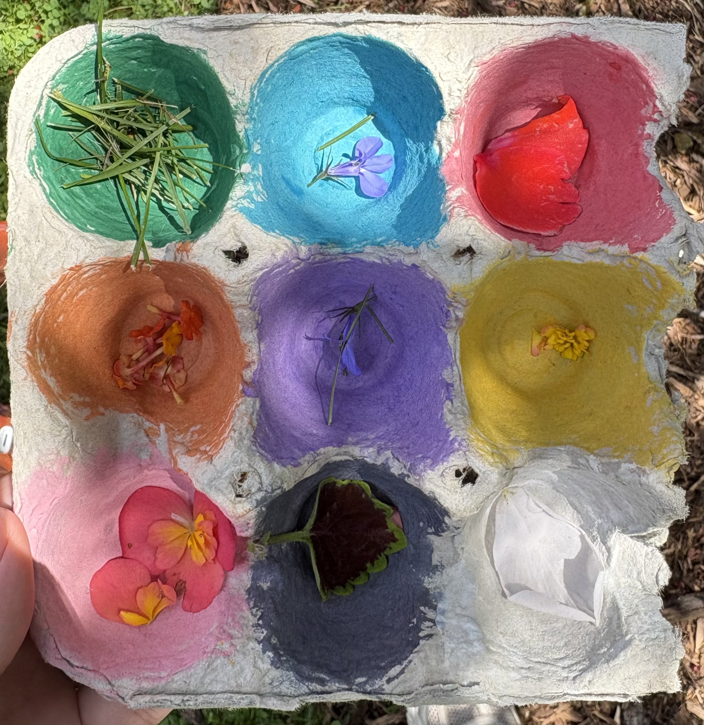 Three painted rocks with messages and designs, placed on green grass. One says "You are appreciated," the second has "Stay strong" with decorative elements, and the third says "I am important too" with colorful dots.