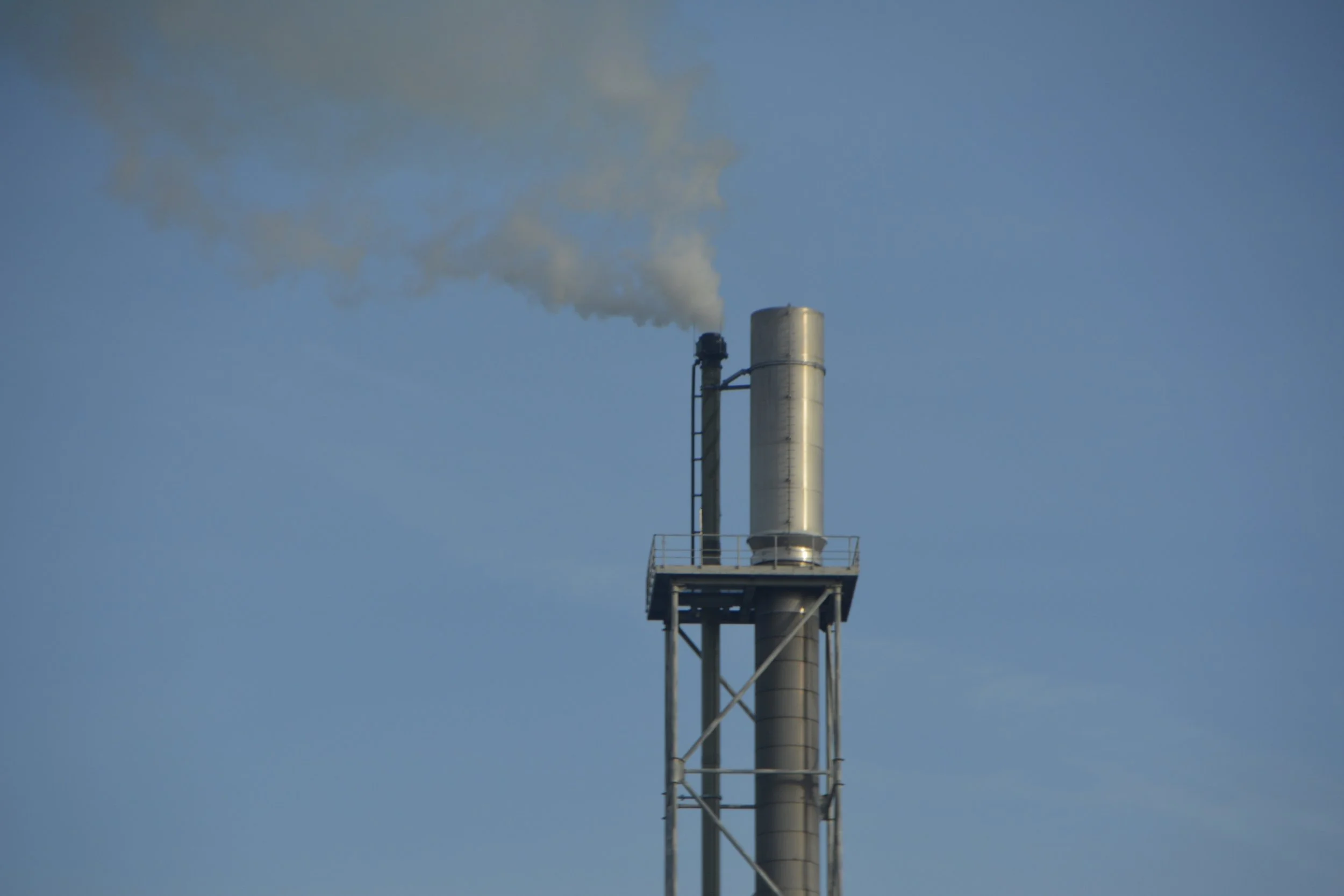 low-angle-view-smoke-stack-against-sky.jpg
