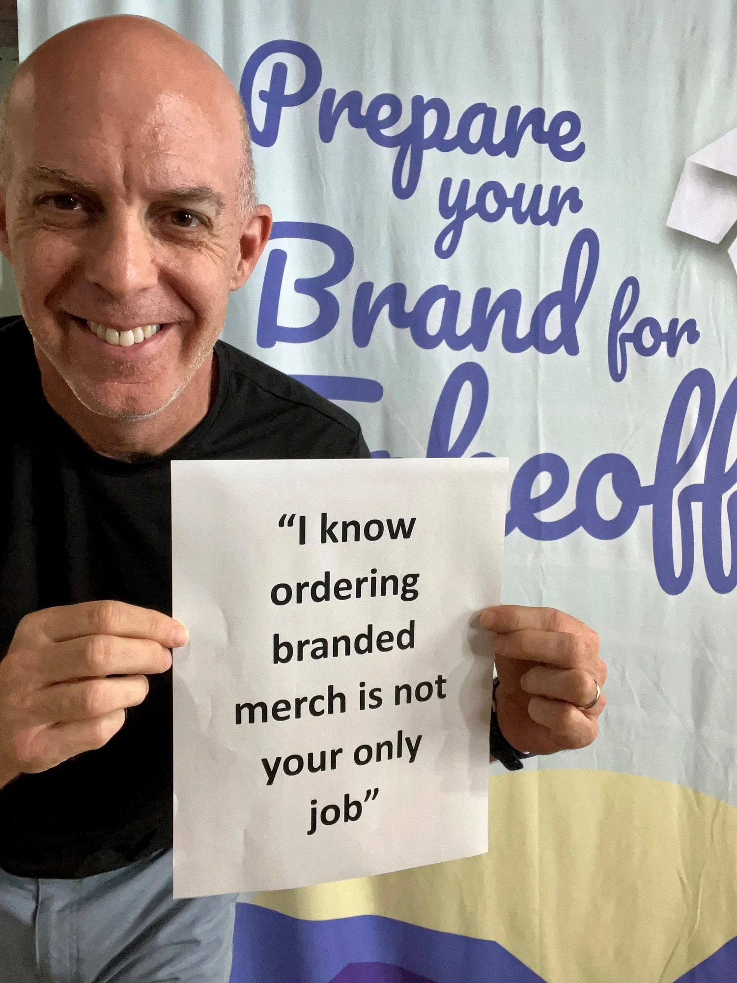 Image of a client service team reviewing branded merchandise proofs and shipment schedules, symbolizing accuracy, on‑time delivery, and worry‑free project management.