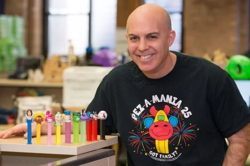 Photo of a branded merchandising consultant reviewing client questions and promotional product samples, representing the process of selecting the perfect items based on goals and audience.